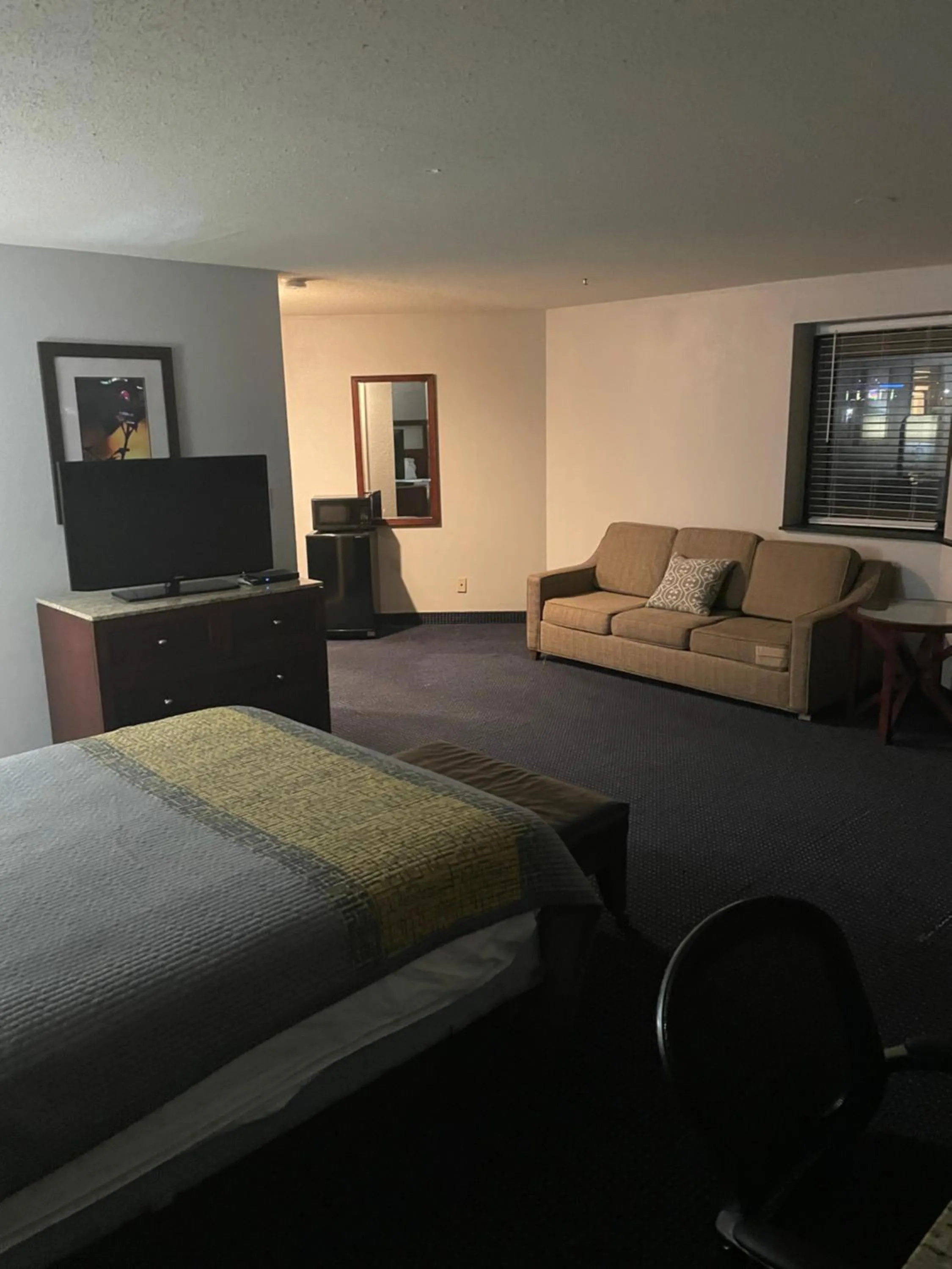 Bed in Apm Inn & Suites