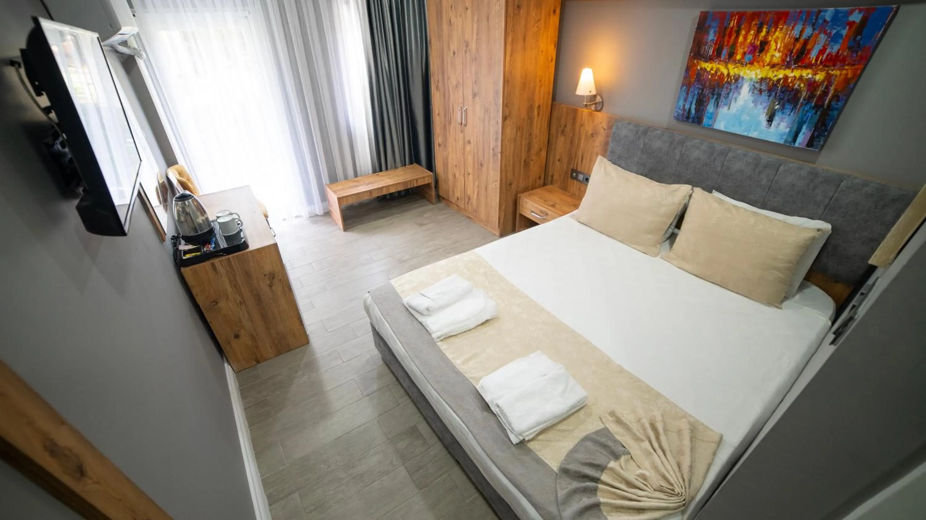 Communal lounge/ TV room, Bed in La Cactus Boutique Hotel