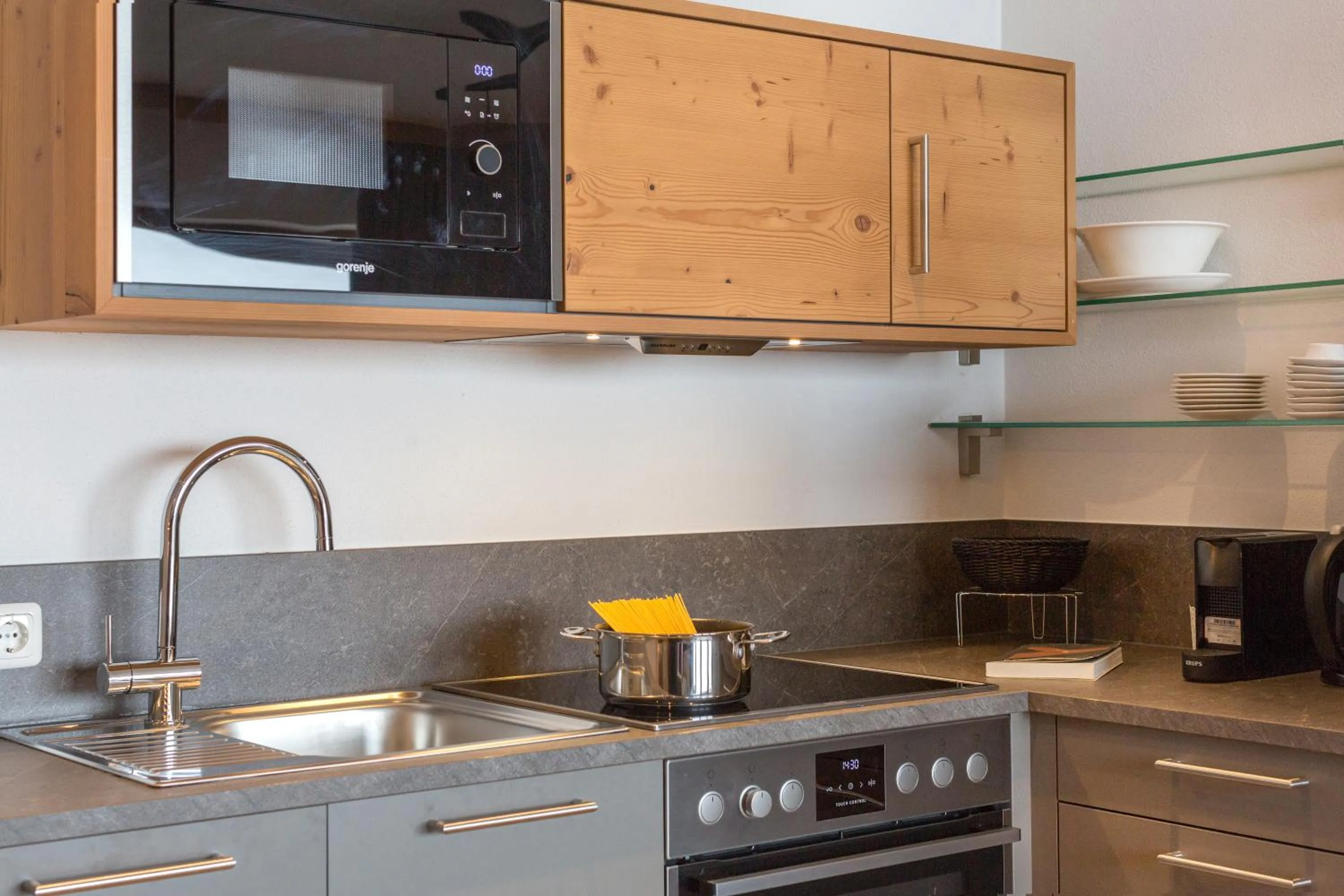 Kitchen or kitchenette in Das Grünholz Aparthotel