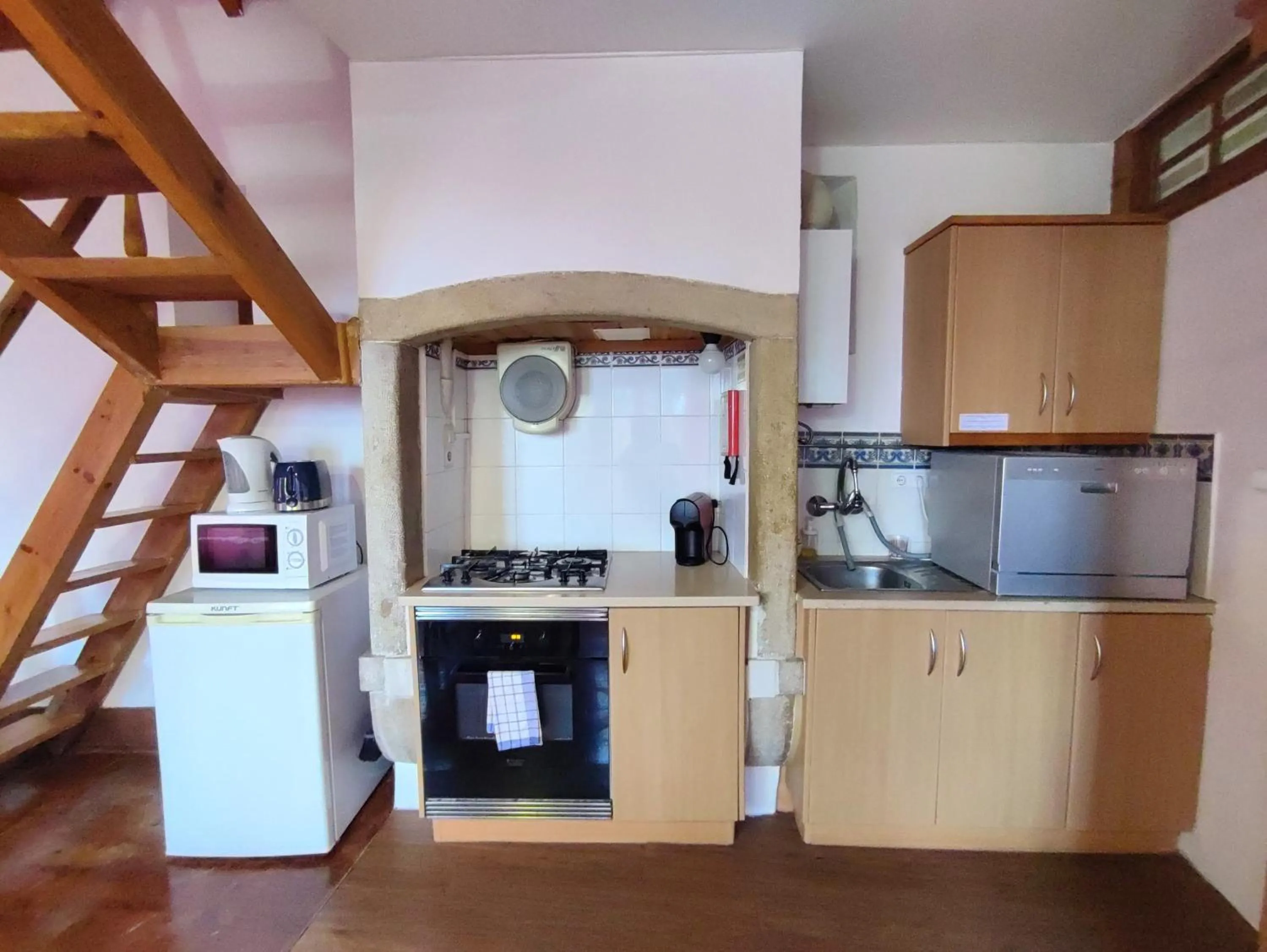 Kitchen or kitchenette in Casas da Biquinha