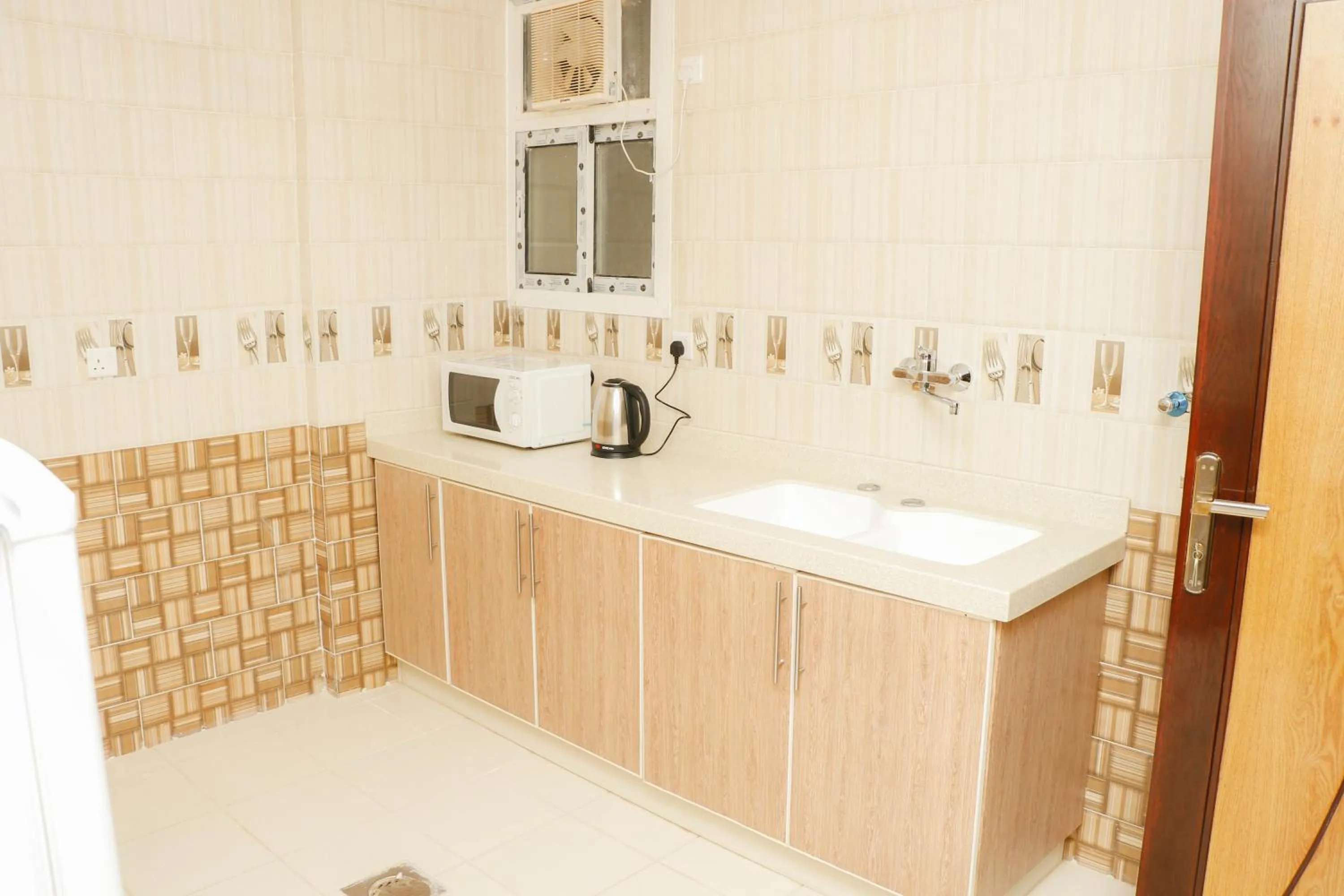Kitchen or kitchenette in Diafat Alsaadah For Serviced Apartment-Dumat Al Jandal