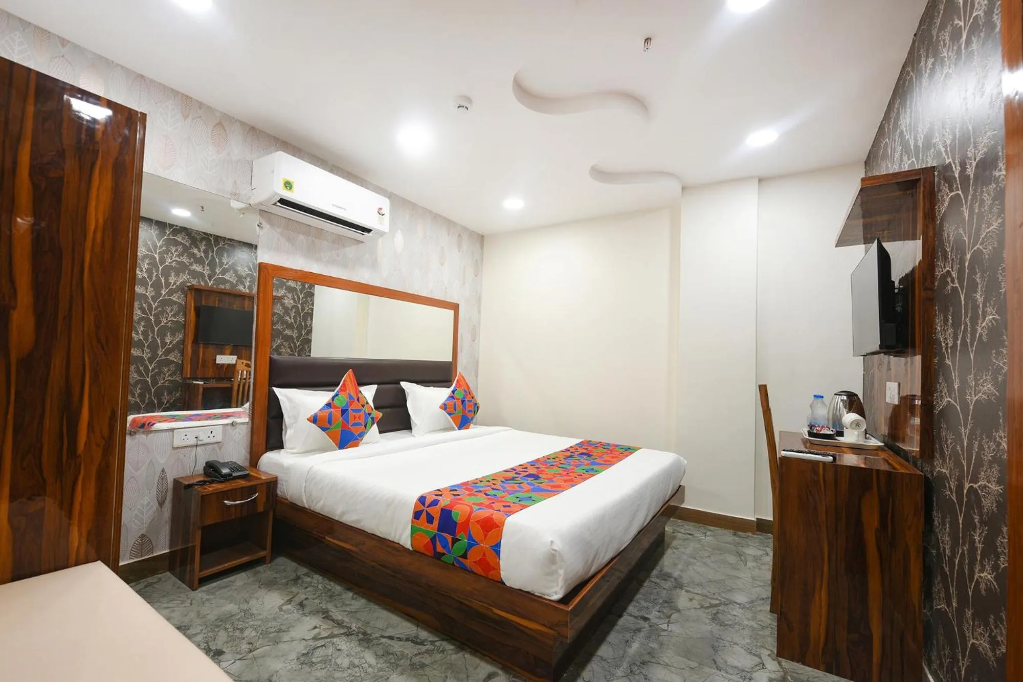 Bed in FabHotel Mona Continental - Nr Laxmi Nagar IT Hub