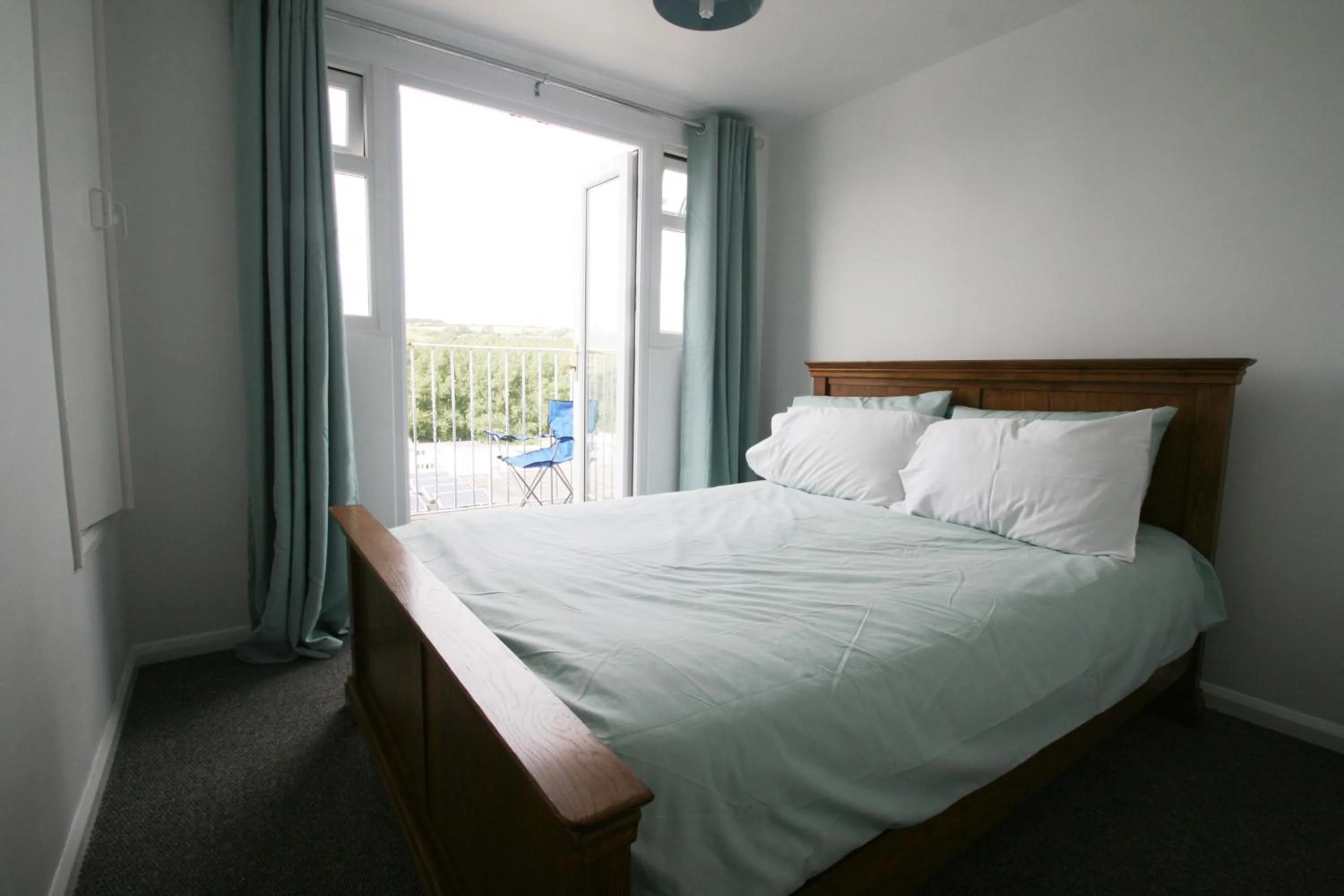 Photo of the whole room, Bed in Freshwater Bay Holiday Cottages