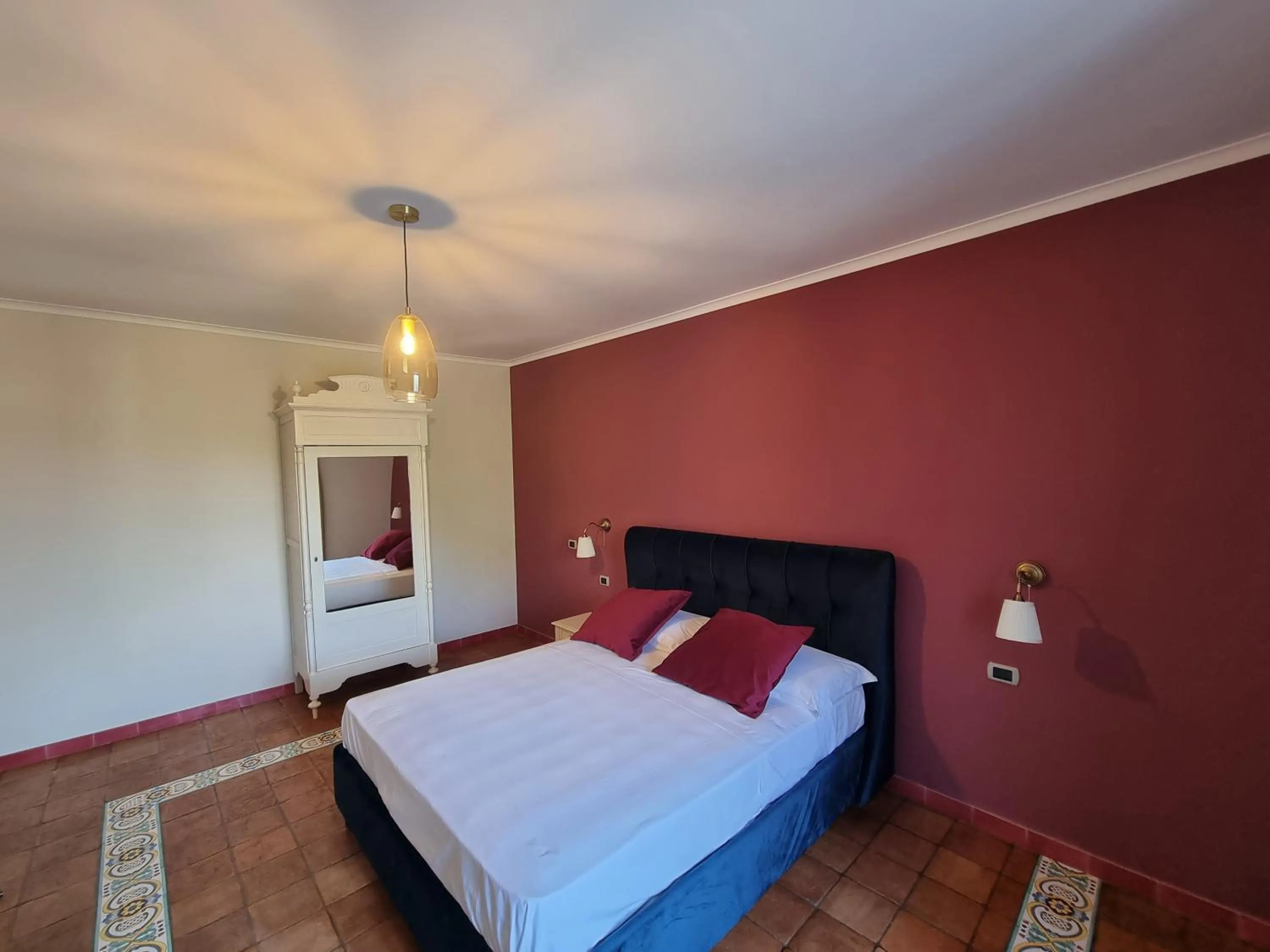 Bed in Casa Fifina Rooms