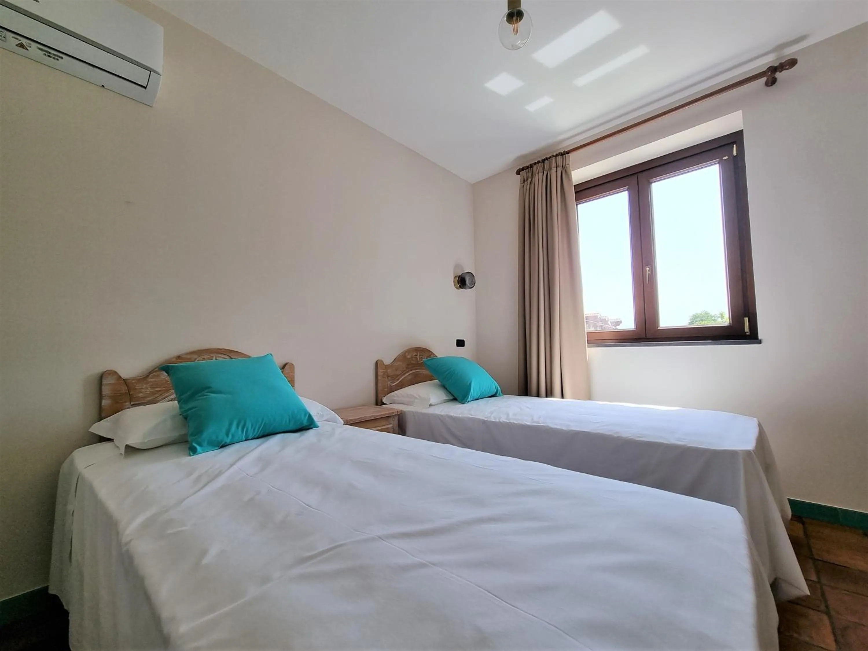 Bed in Casa Fifina Rooms