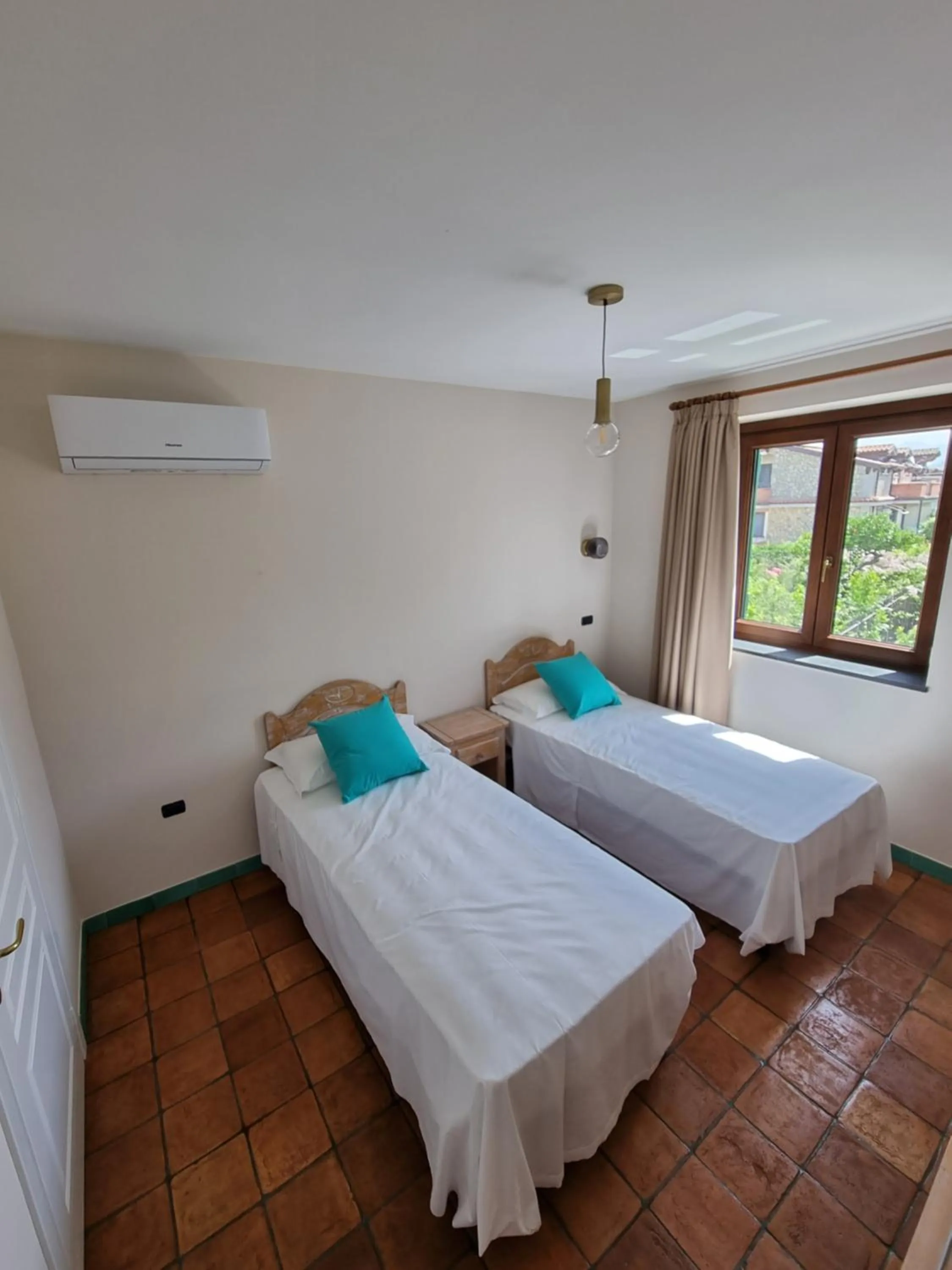 Bed in Casa Fifina Rooms