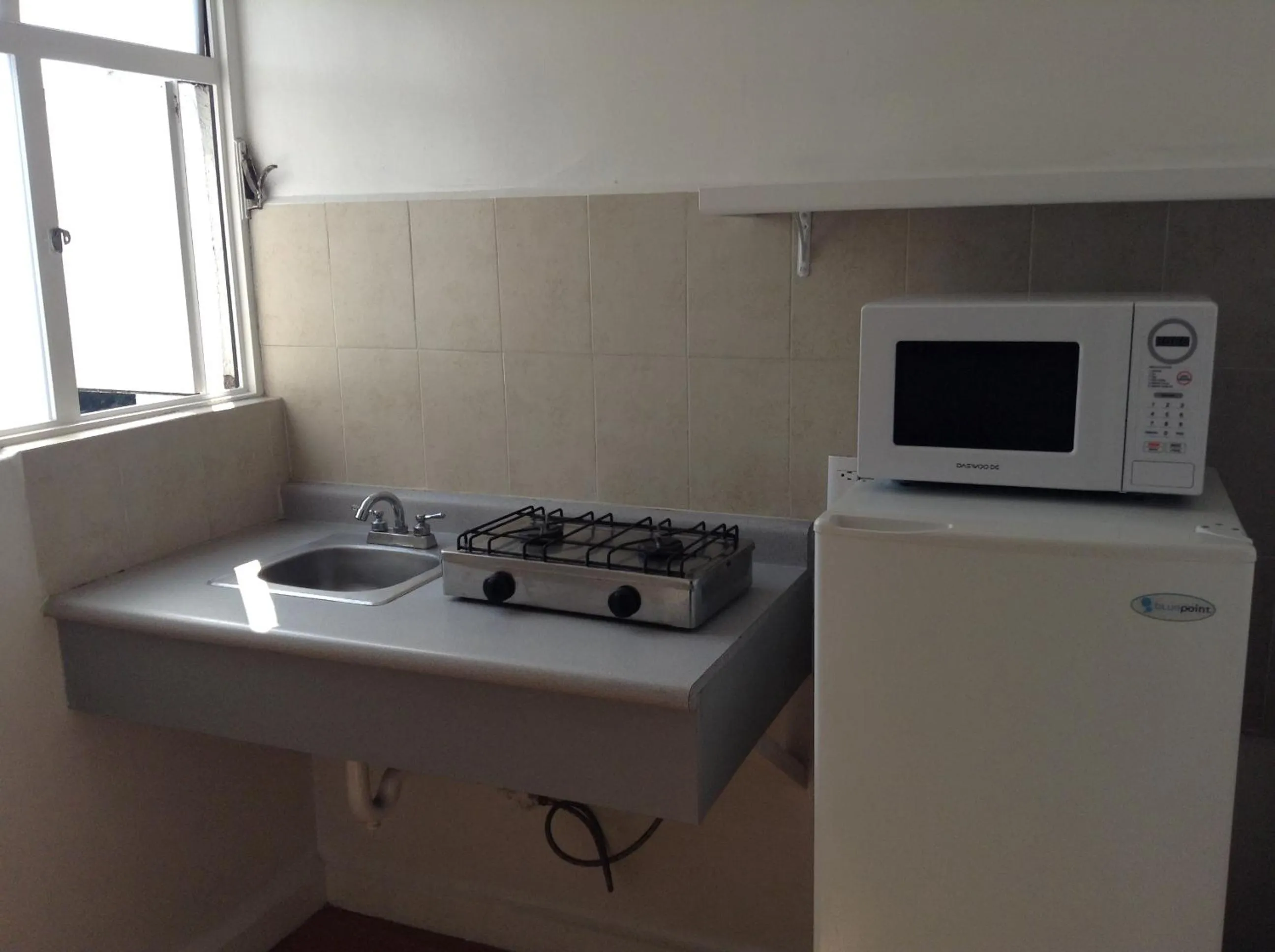 Kitchen or kitchenette in Suites Havre