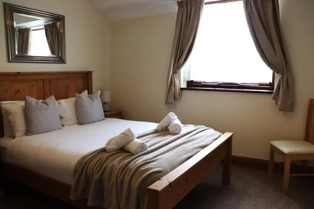 Bed in Glyndley Manor Cottages