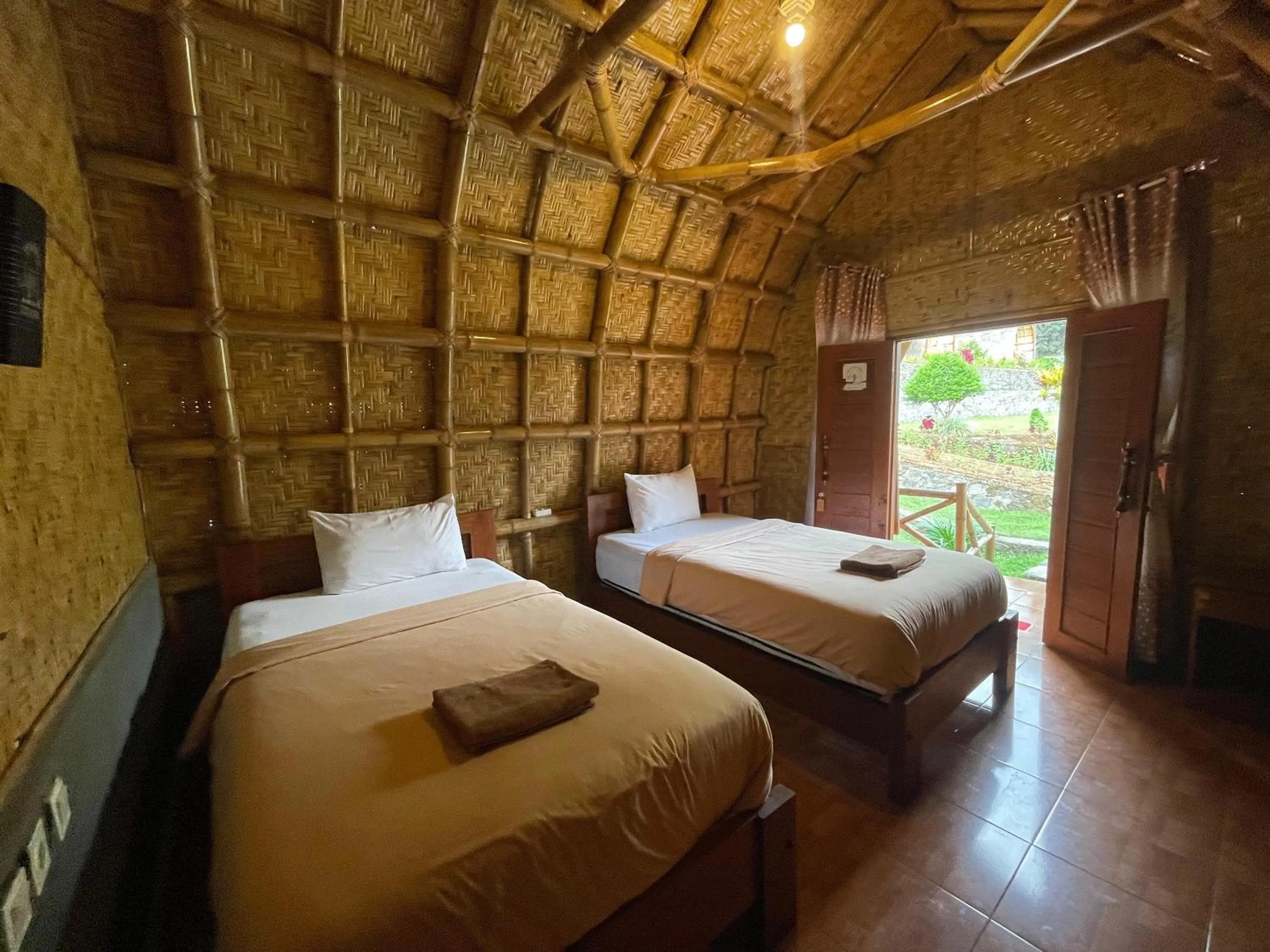 Bed in Villa Bambu Rinjani & Restaurant