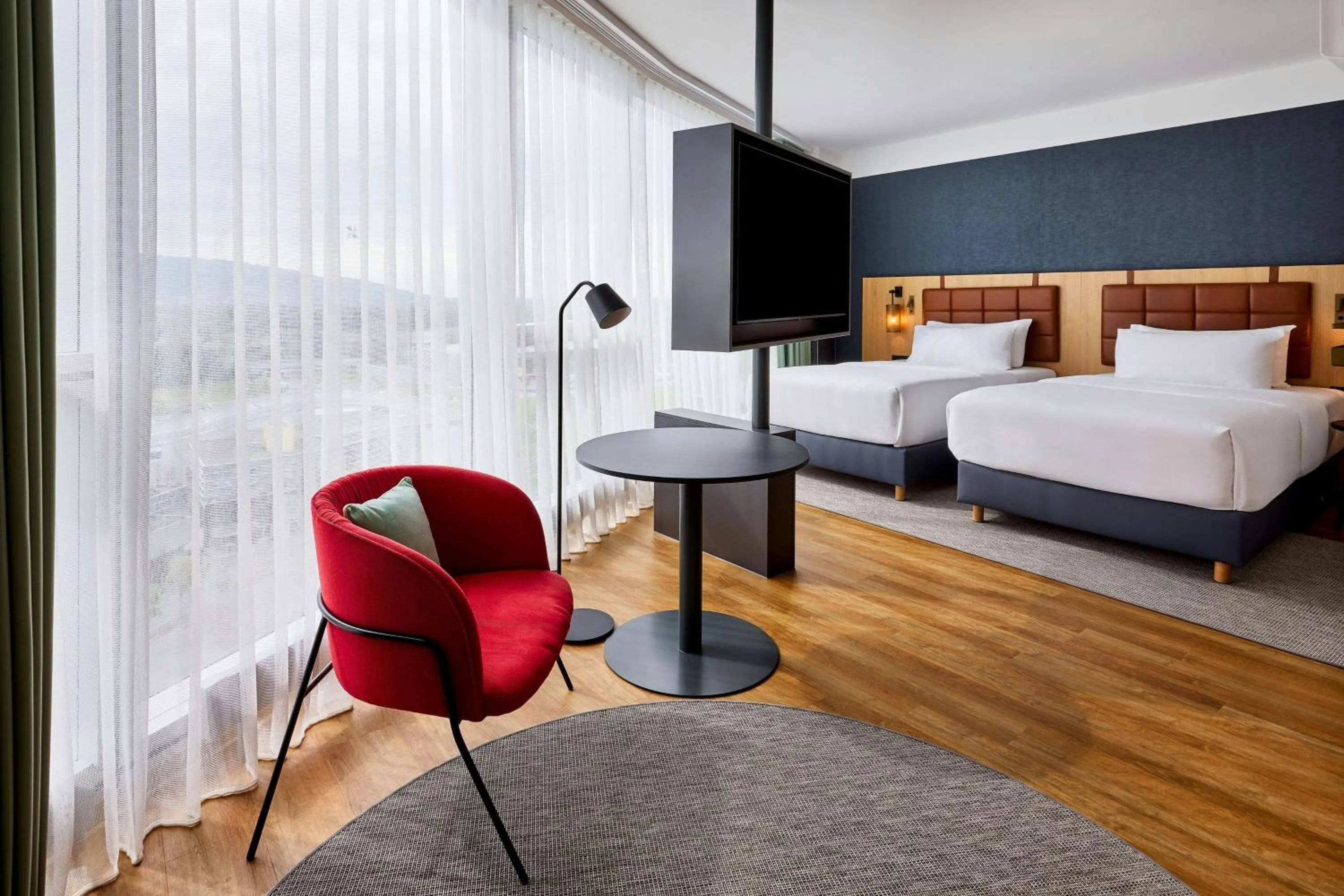 Photo of the whole room, Bed in Four Points by Sheraton Panoramahaus Dornbirn
