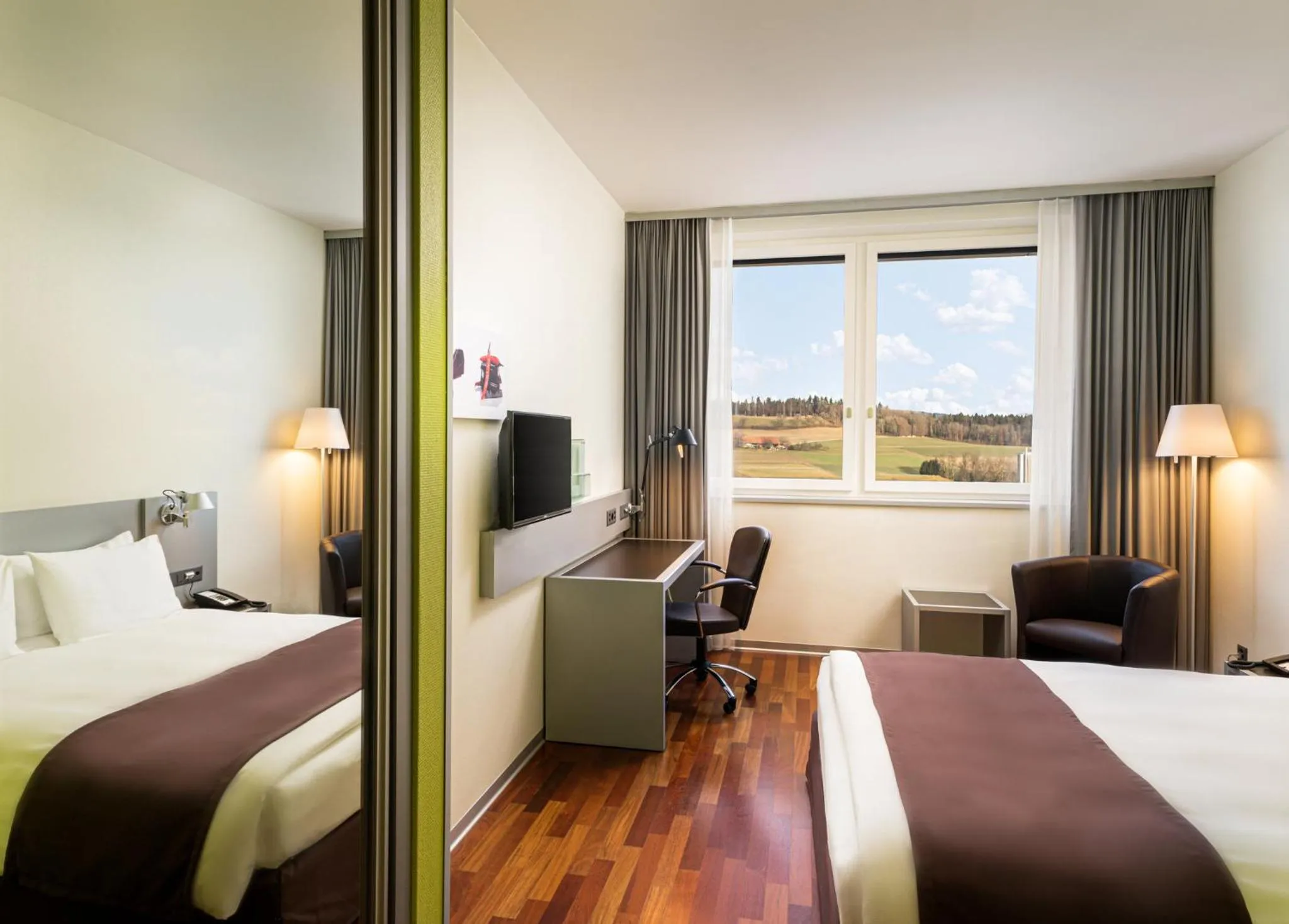 Photo of the whole room, Bed in Holiday Inn Bern Westside by IHG