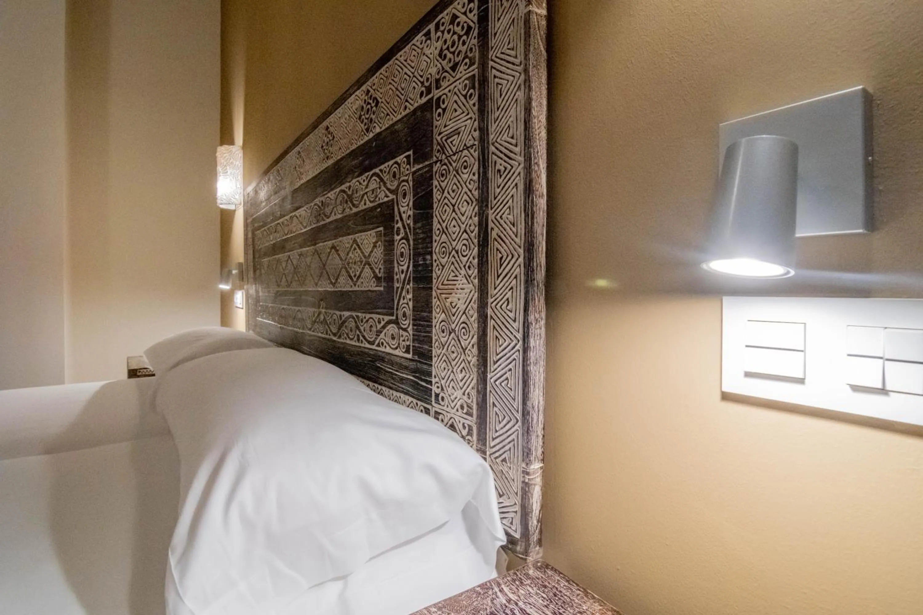 Decorative detail, Bed in Tarifa Suites by QHotels
