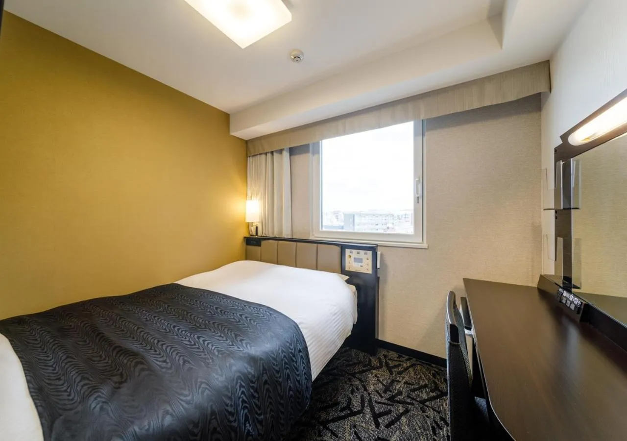 Photo of the whole room, Bed in APA Hotel Hakata Ekimae 3Chome