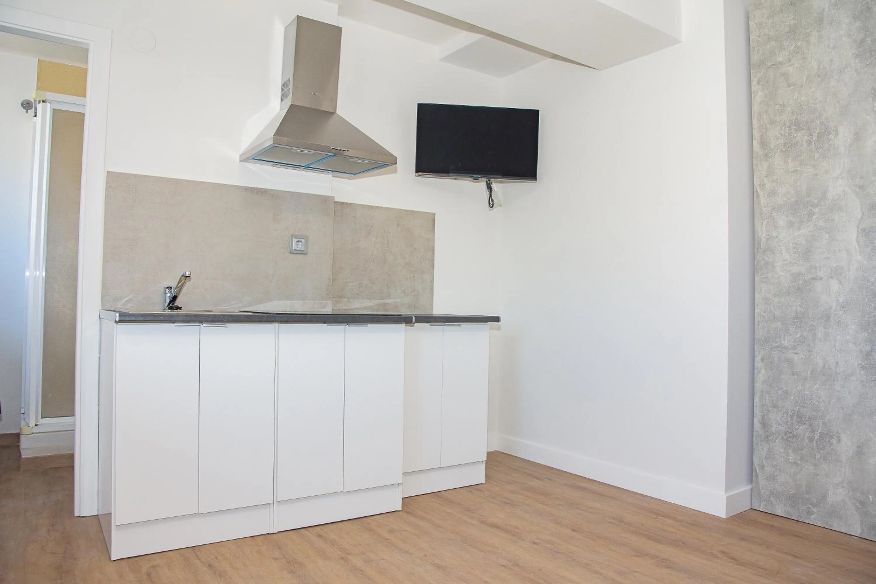 Kitchen or kitchenette in Apartamentos Santander Maliaño Suites 3000