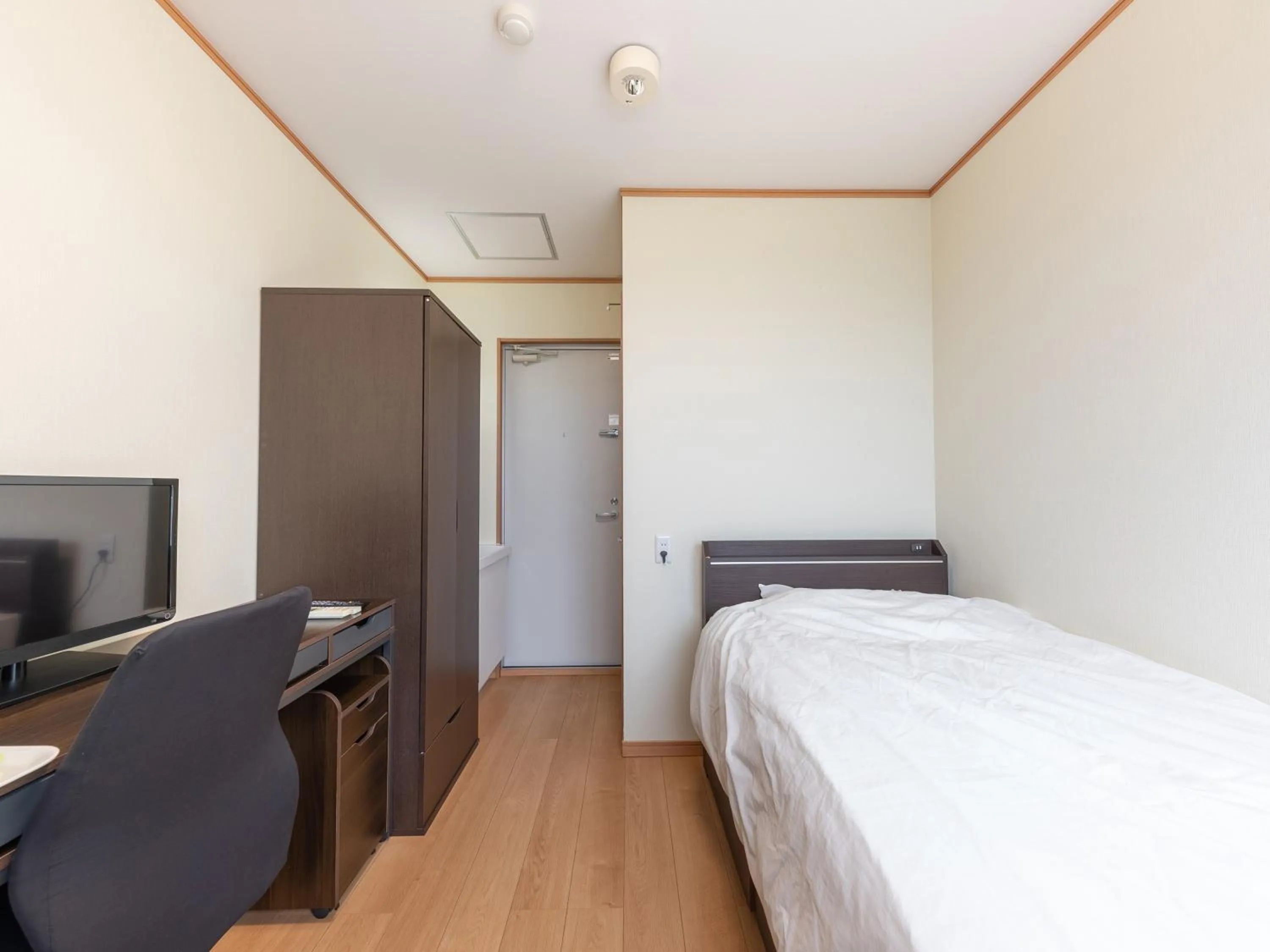 Bed in Tabist Hotel Takagiya Iwaki