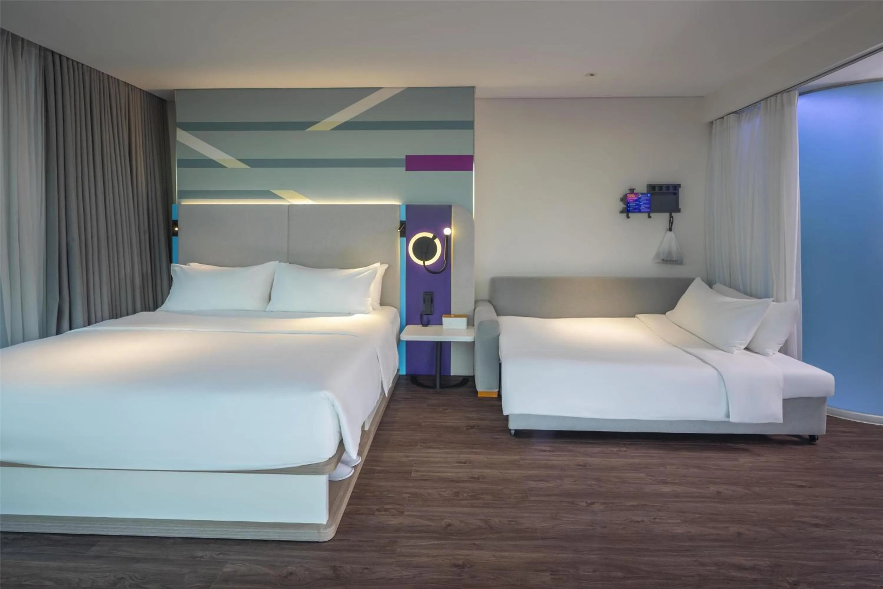 Living room, Bed in Tru by Hilton Hanoi Station