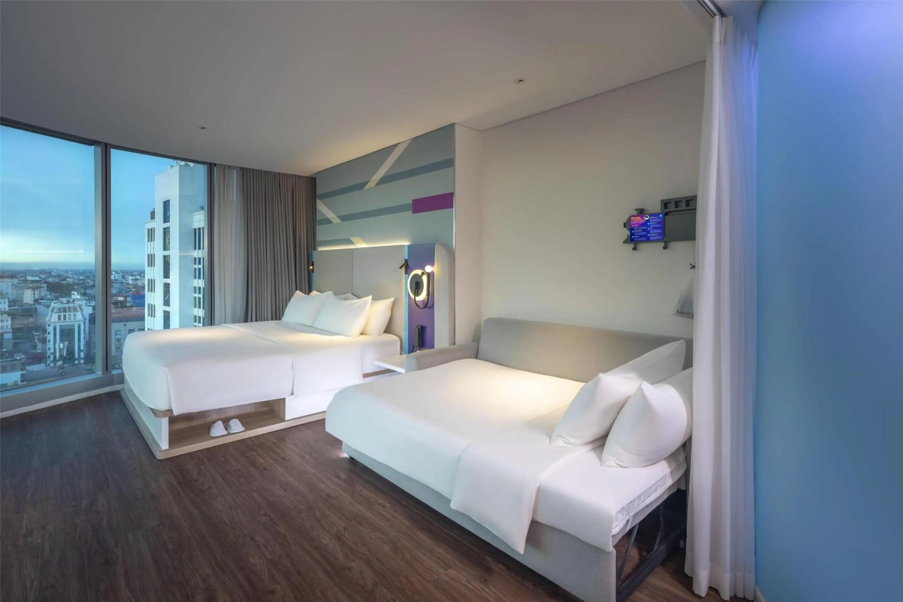 Living room, Bed in Tru by Hilton Hanoi Station