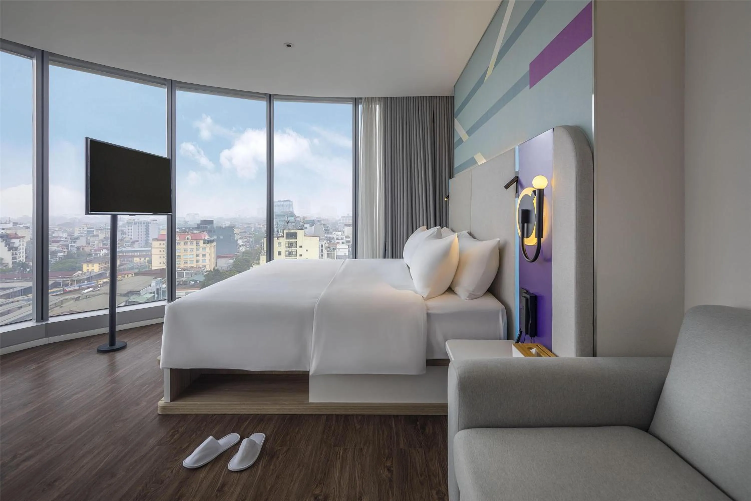 Living room, Bed in Tru by Hilton Hanoi Station