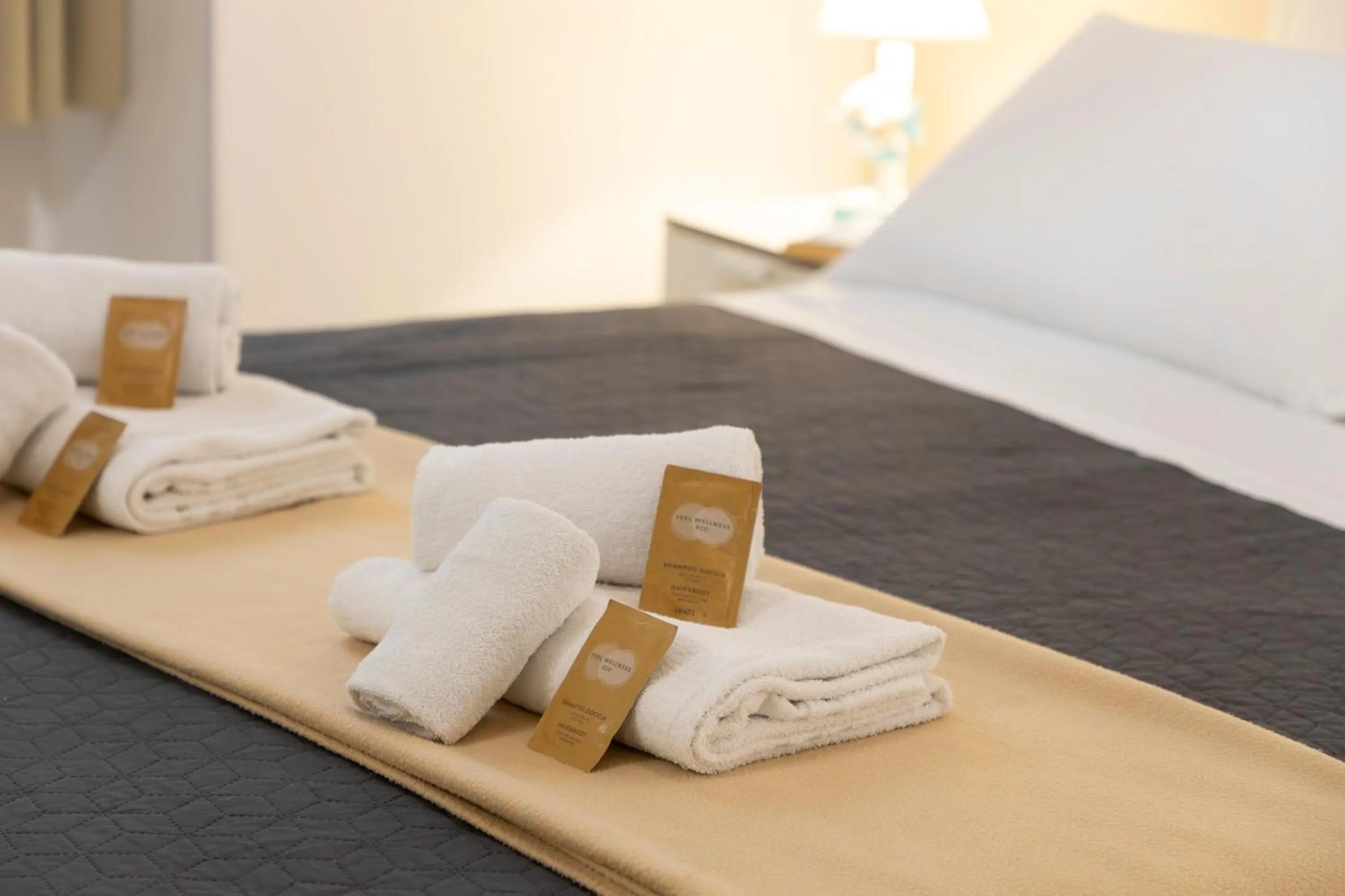 towels, Bed in Approdo Rooms - Eja Sardinia