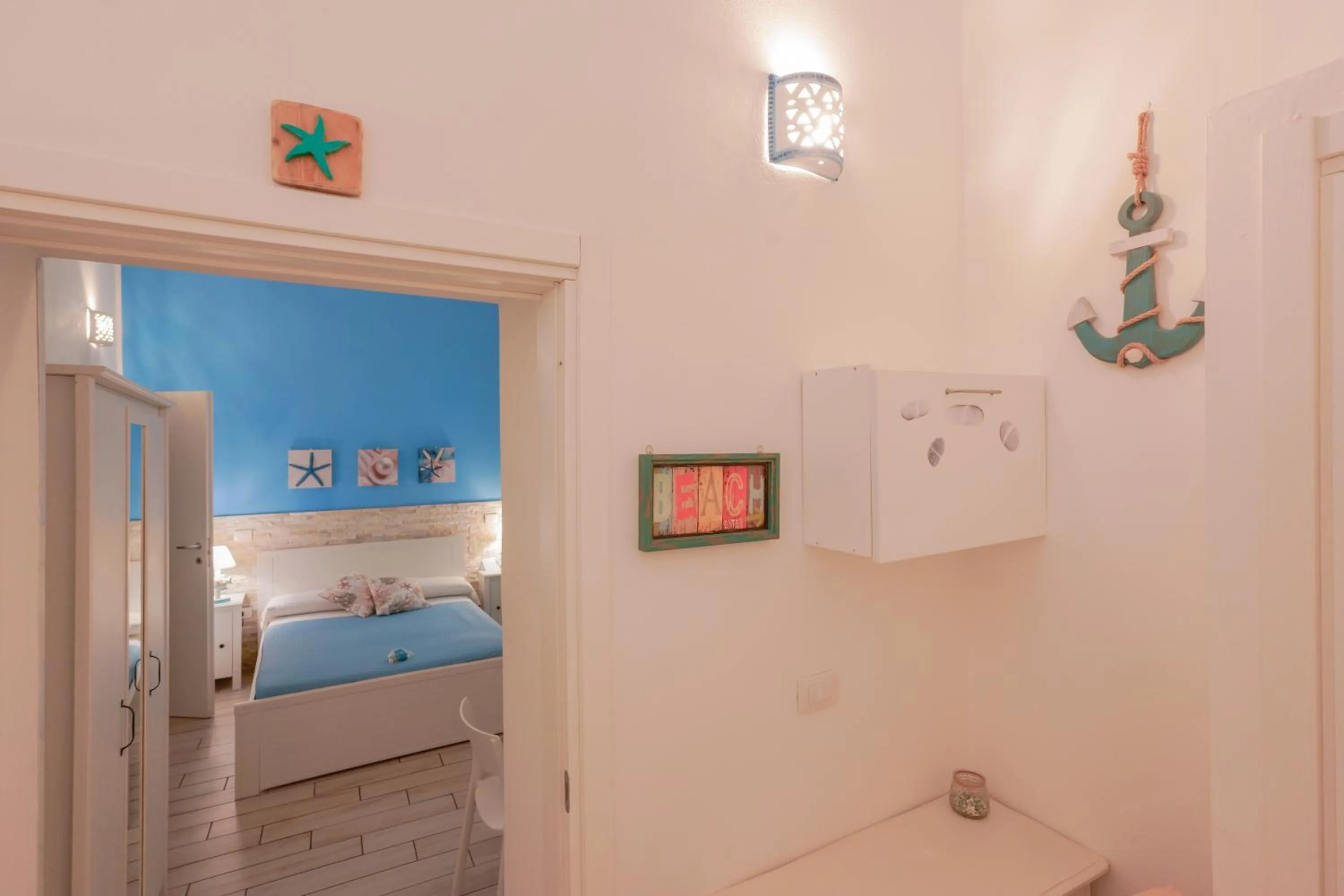Toilet, Bed in Approdo Rooms - Eja Sardinia