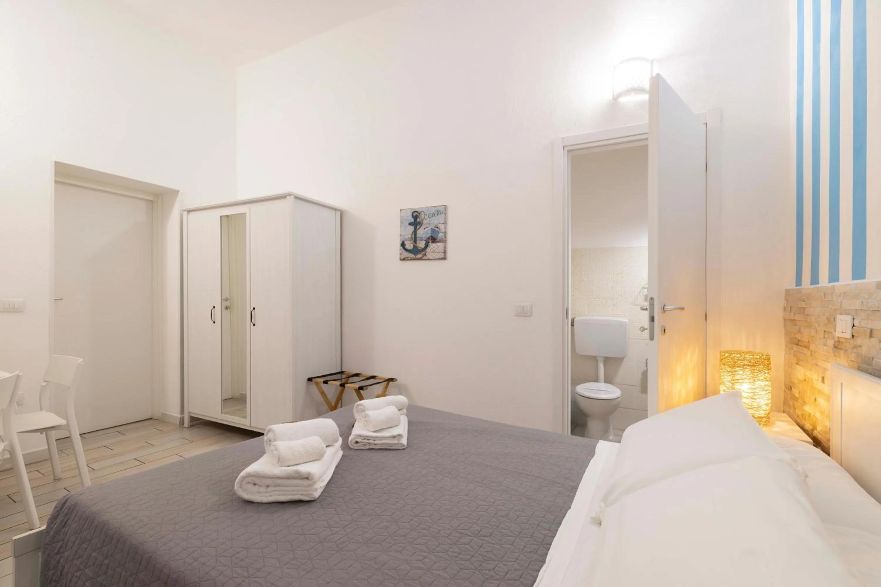 Toilet, Bed in Approdo Rooms - Eja Sardinia
