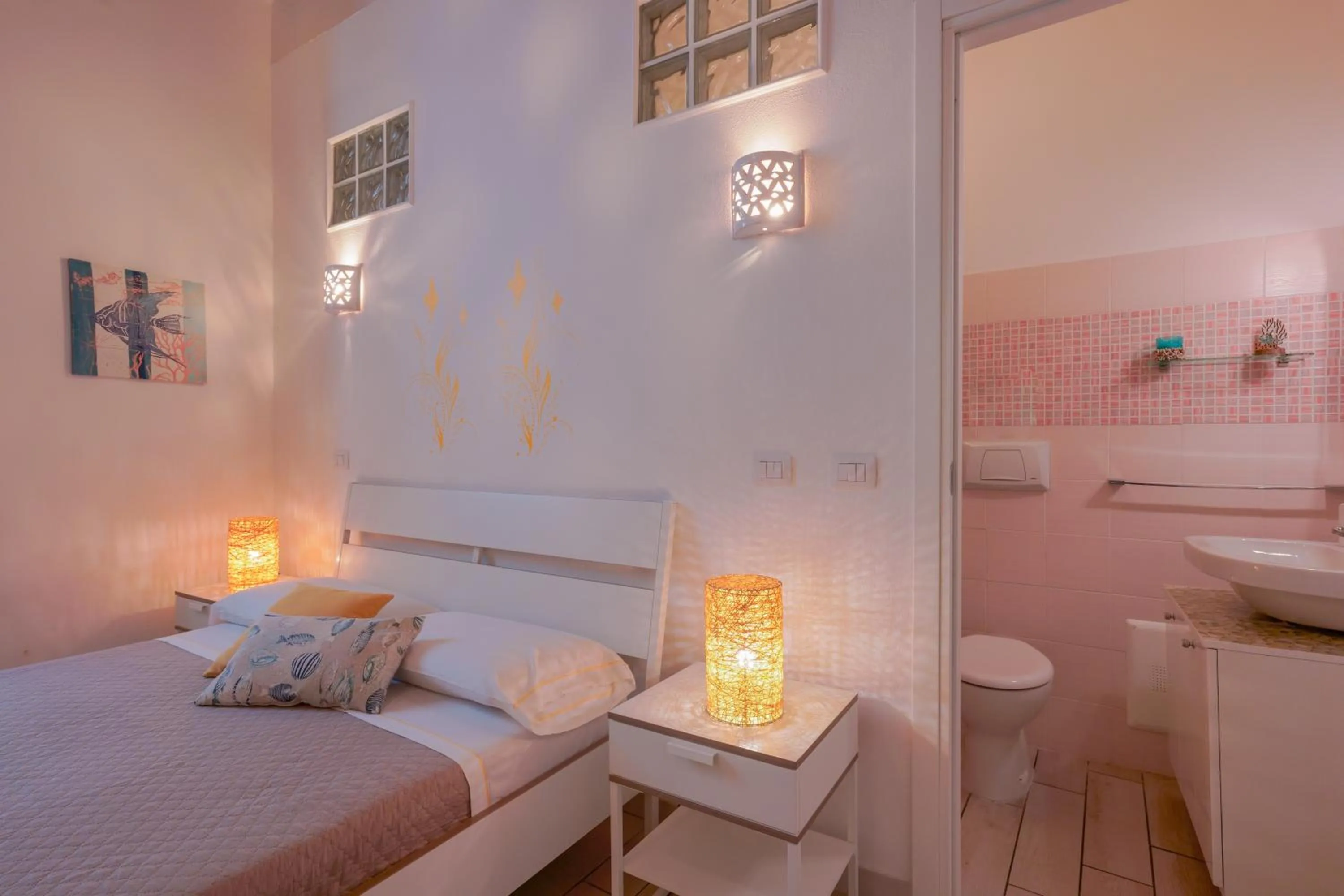 Toilet, Bed in Approdo Rooms - Eja Sardinia