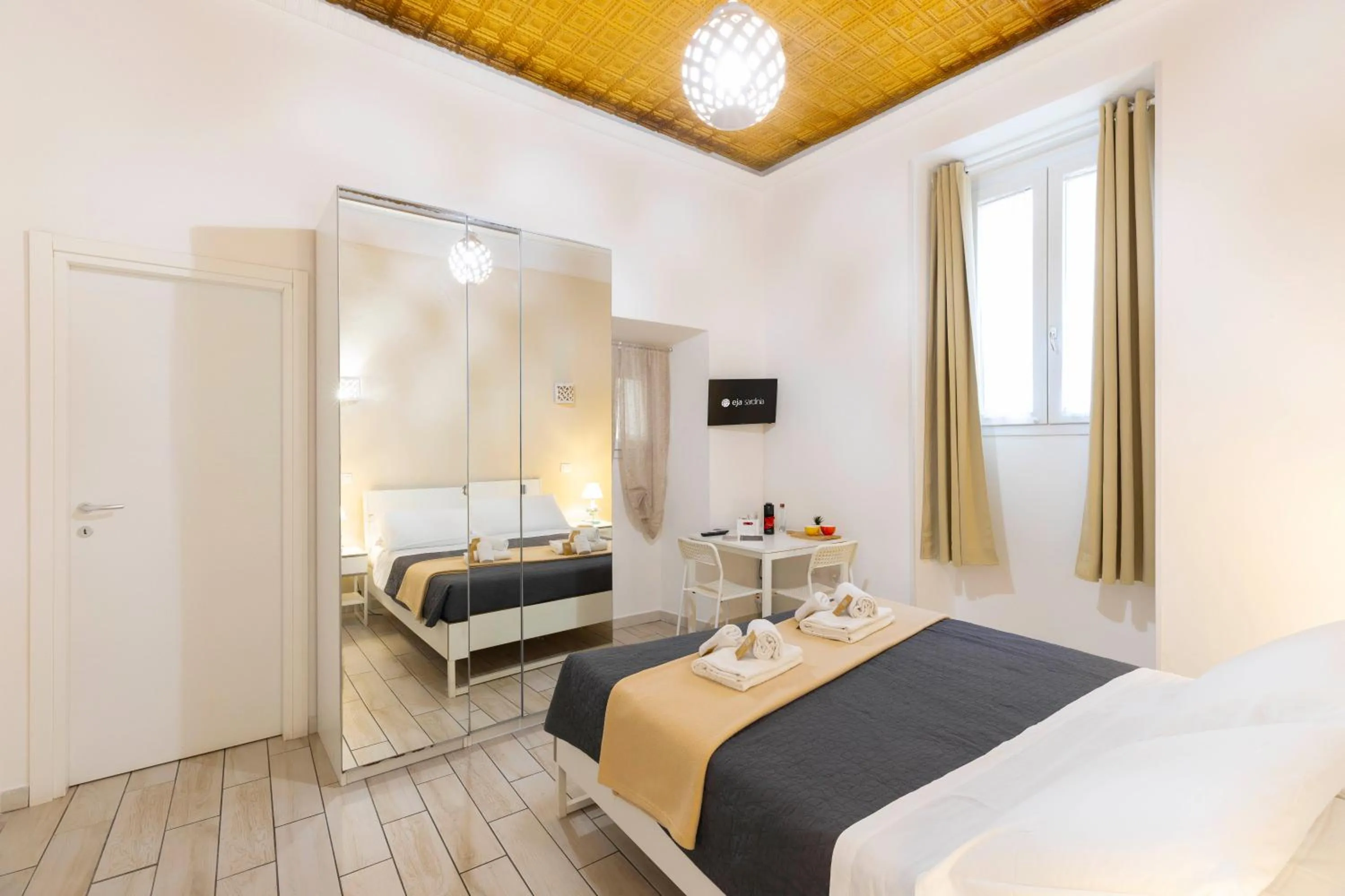 Bed in Approdo Rooms - Eja Sardinia