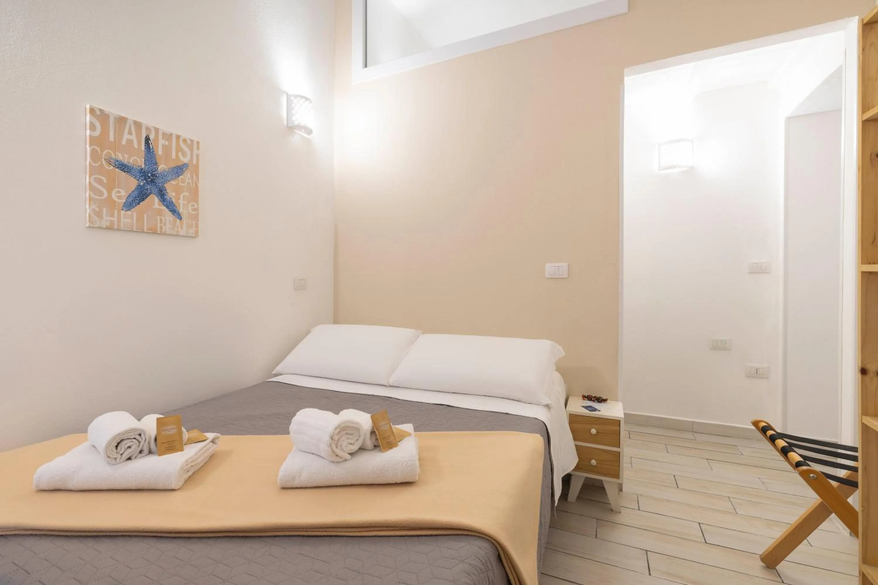 Bed in Approdo Rooms - Eja Sardinia