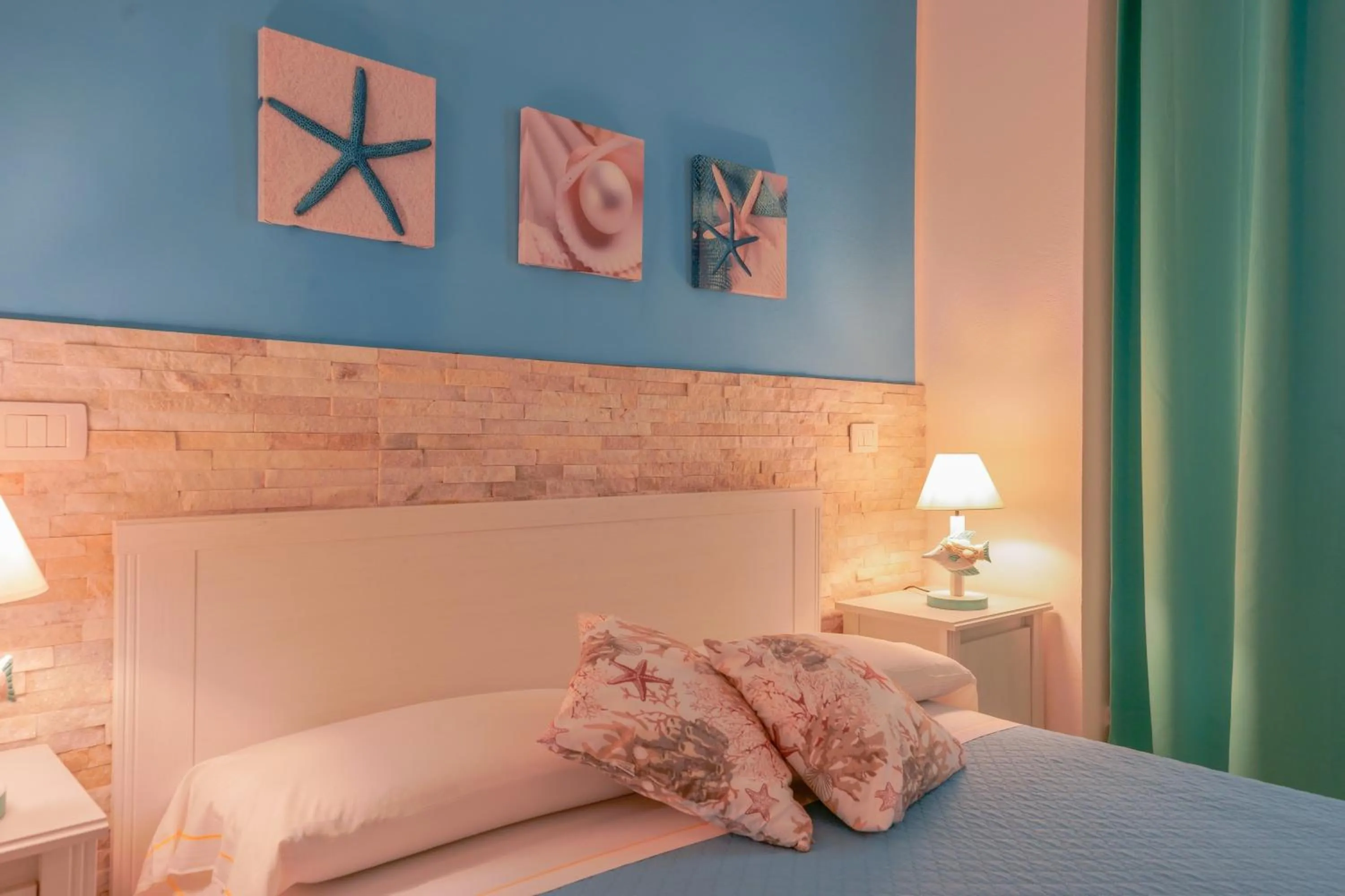 Bed in Approdo Rooms - Eja Sardinia