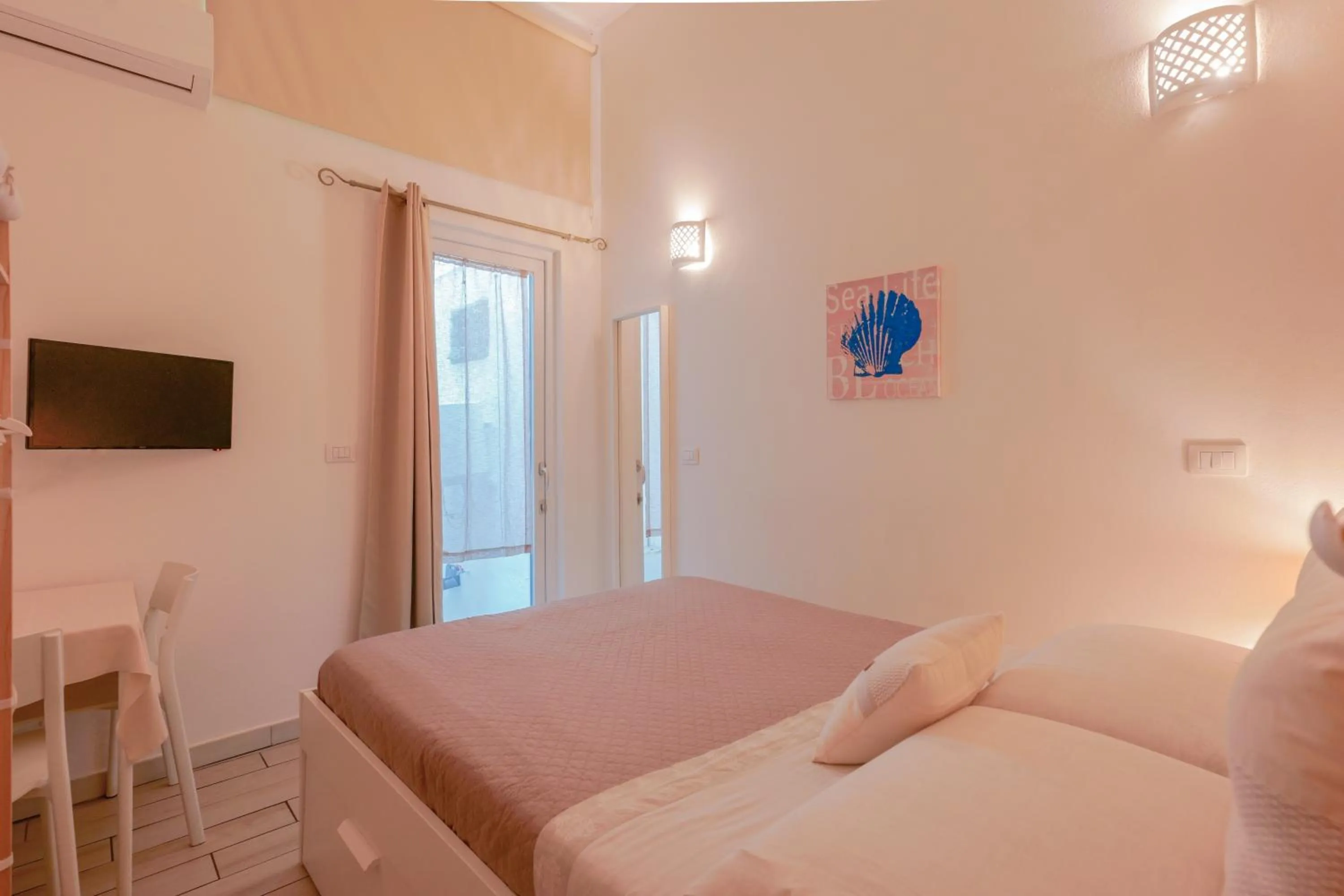 Bed in Approdo Rooms - Eja Sardinia