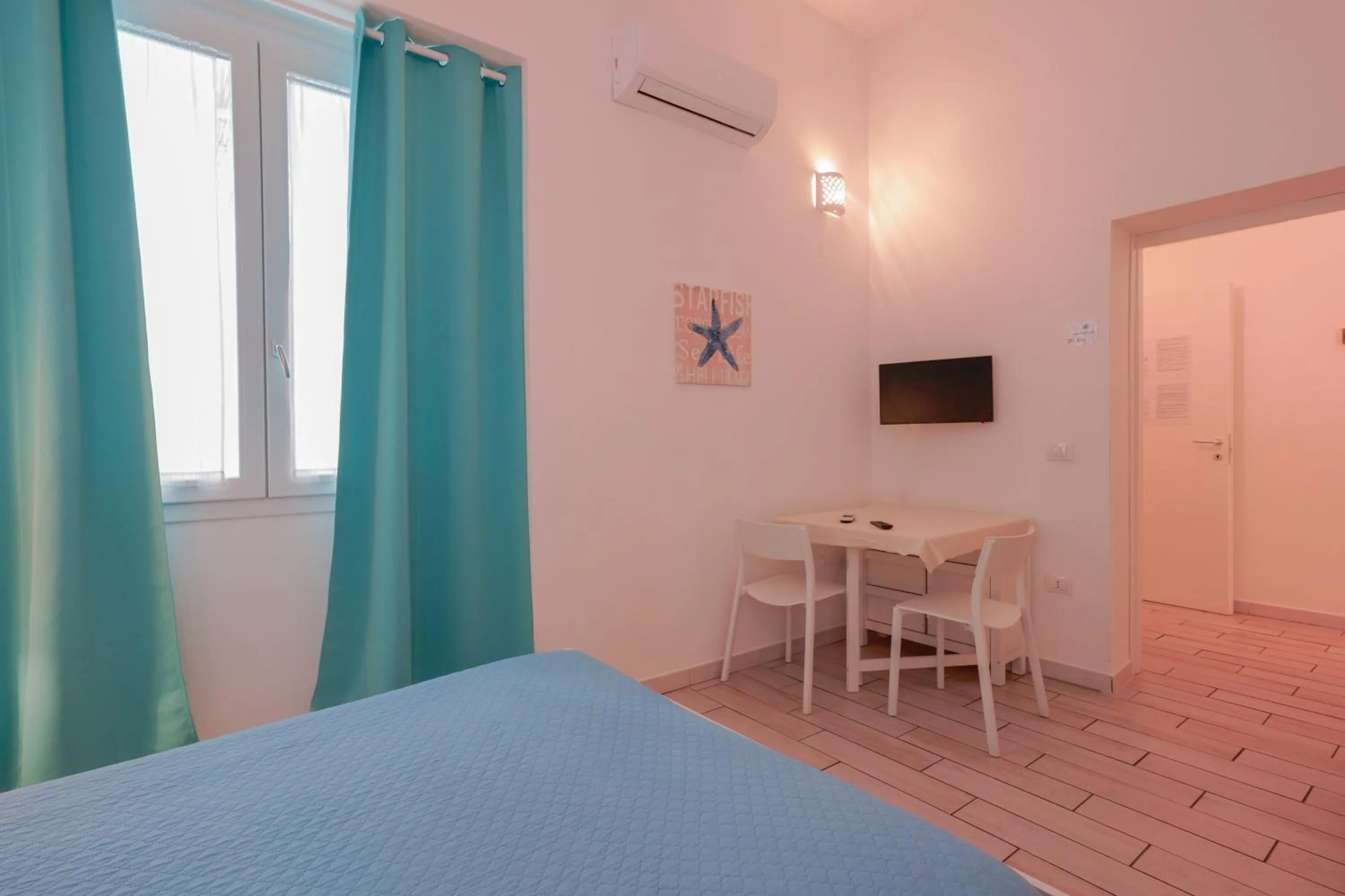 Bed in Approdo Rooms - Eja Sardinia