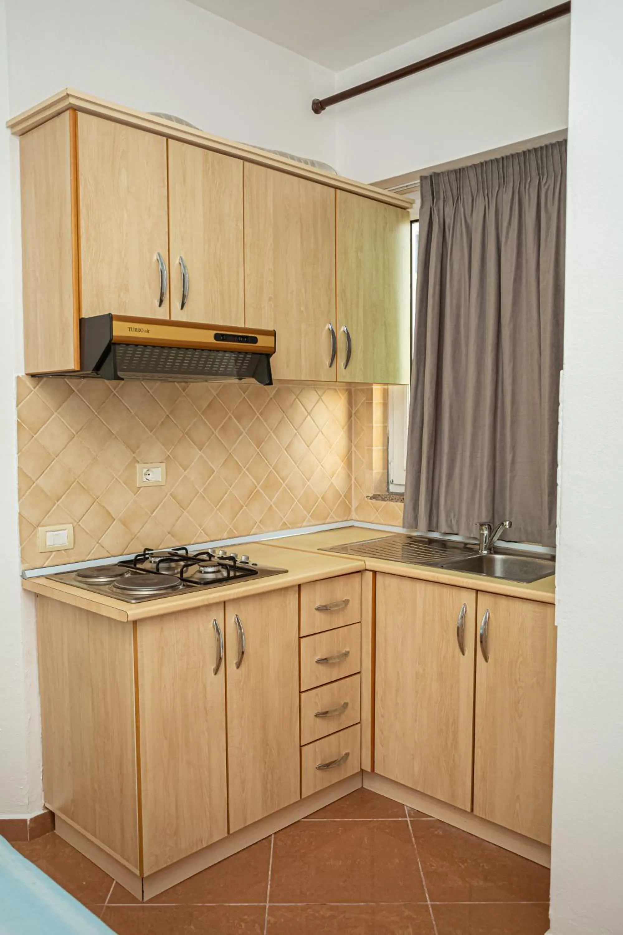 Kitchen or kitchenette in Hotel SUNSET GL