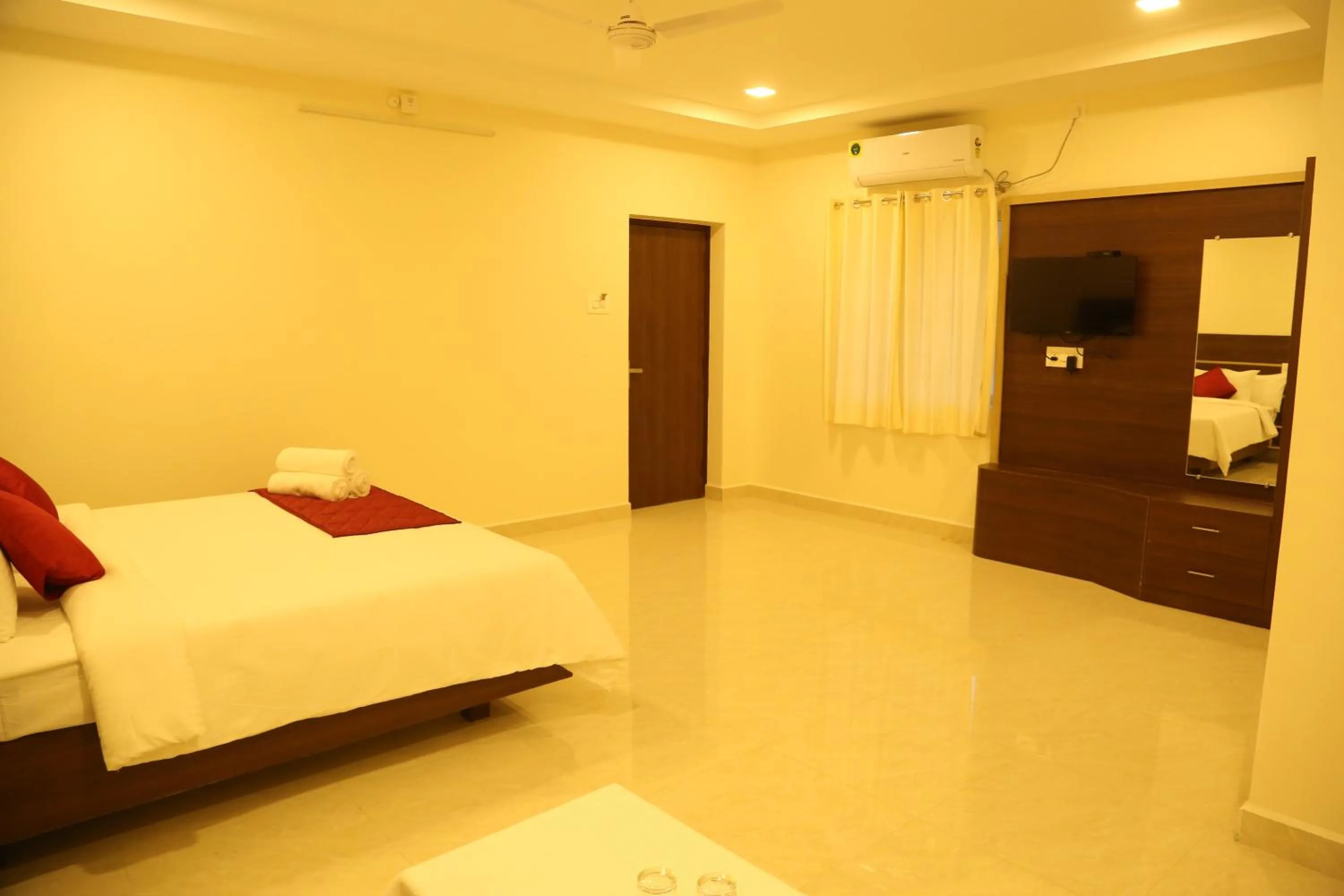 Photo of the whole room, Bed in THAAI RESIDENCY