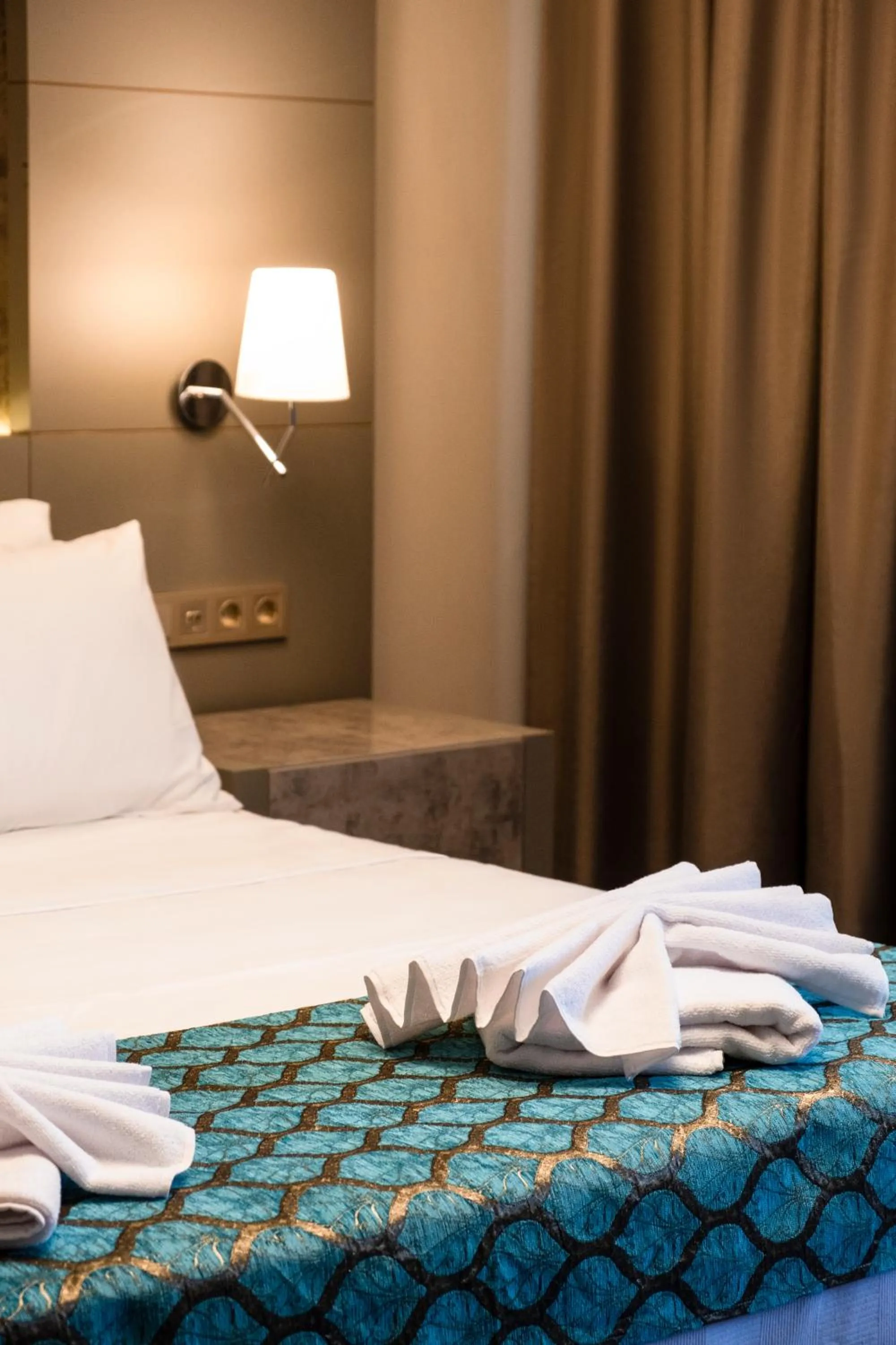 Bed in Acar Suite Hotel