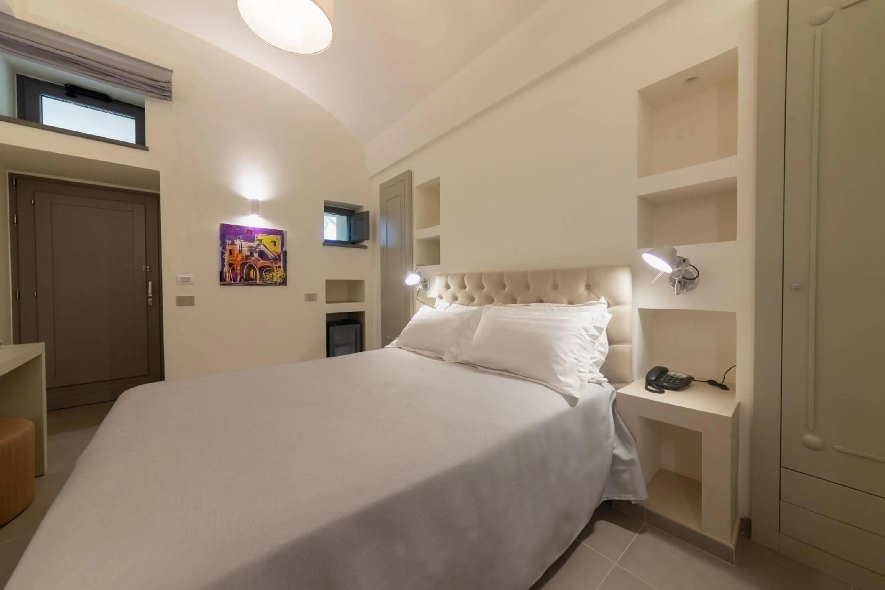 Bed in Insula Boutique Hotel