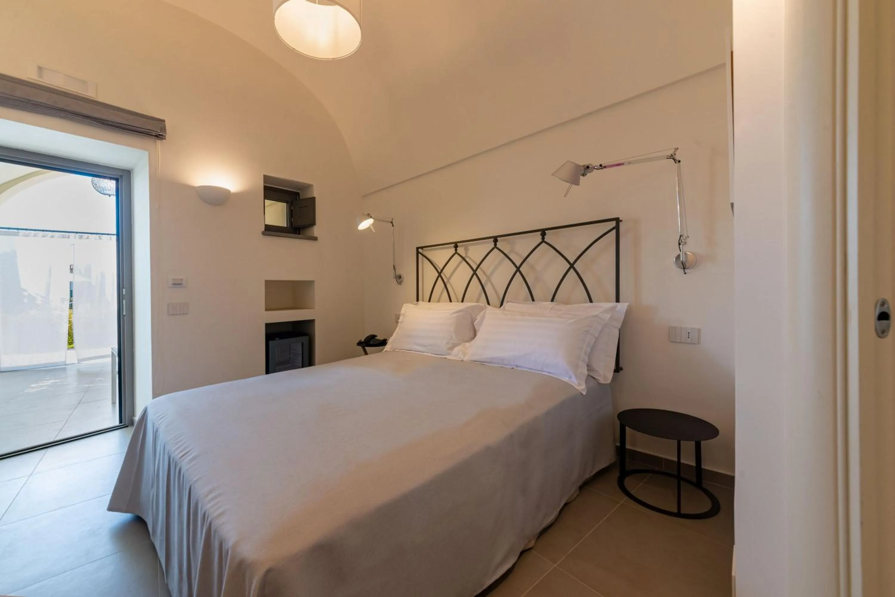 Bed in Insula Boutique Hotel