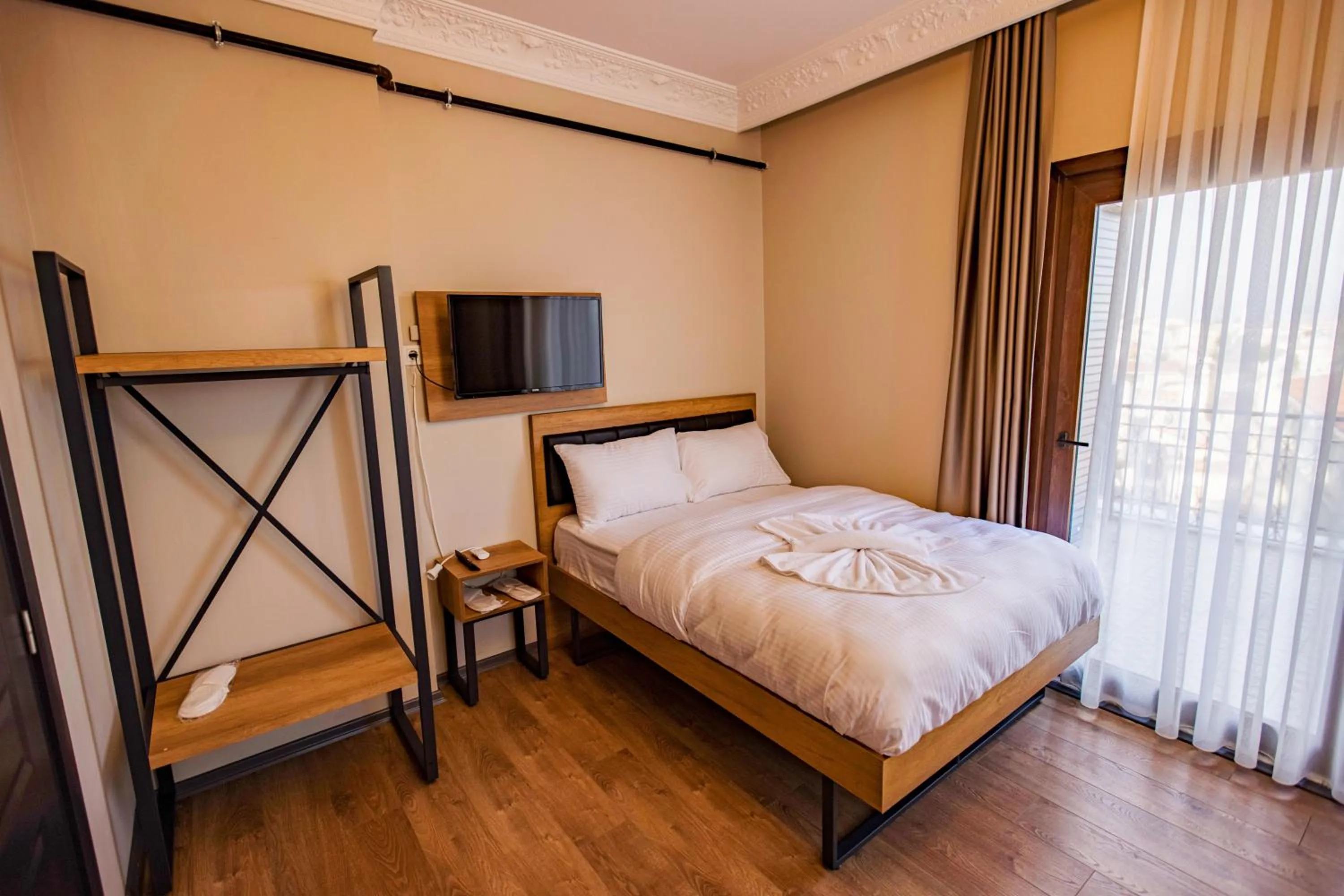 Bed in Grand Balyan Hotel & Restaurant