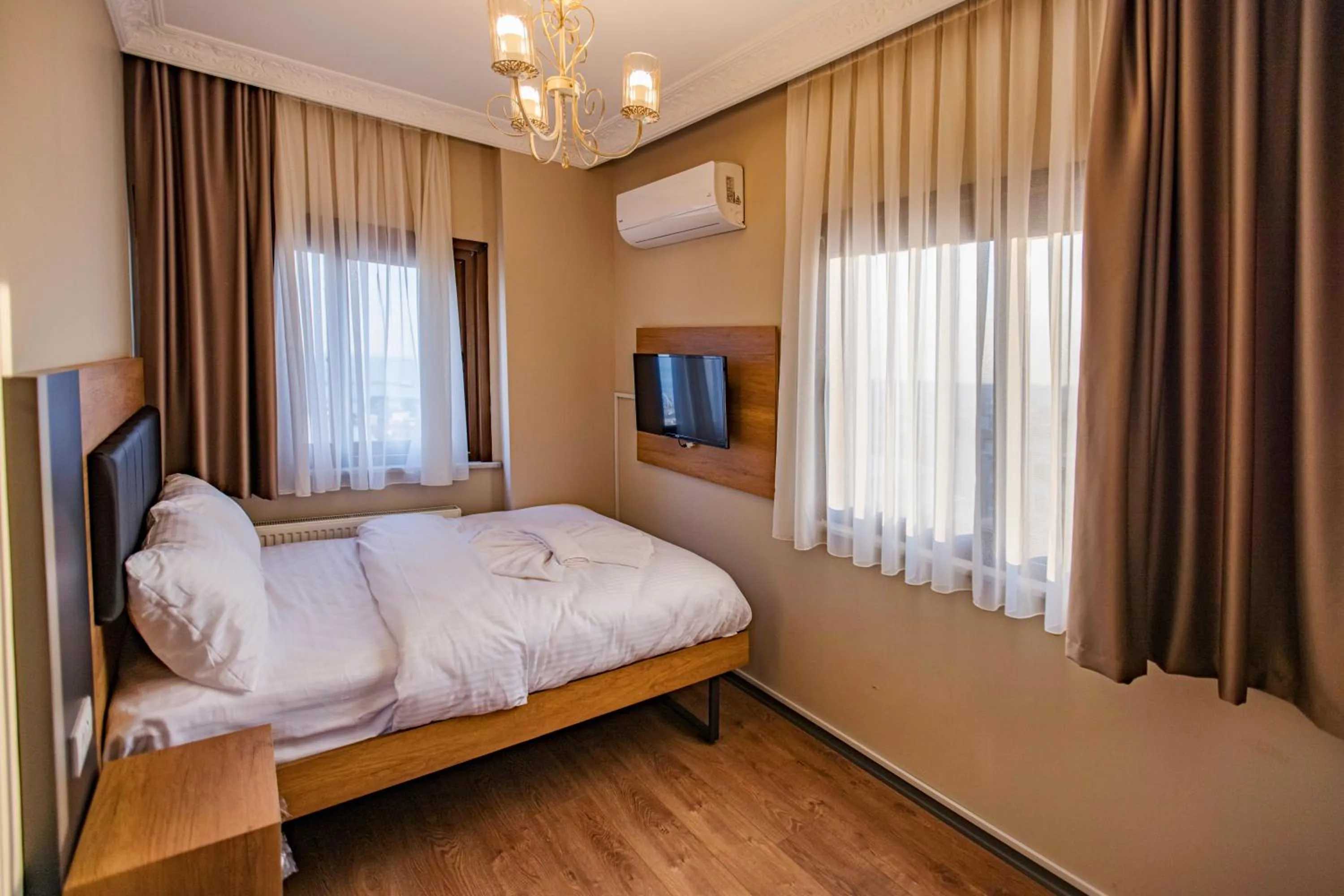 Bed in Grand Balyan Hotel & Restaurant