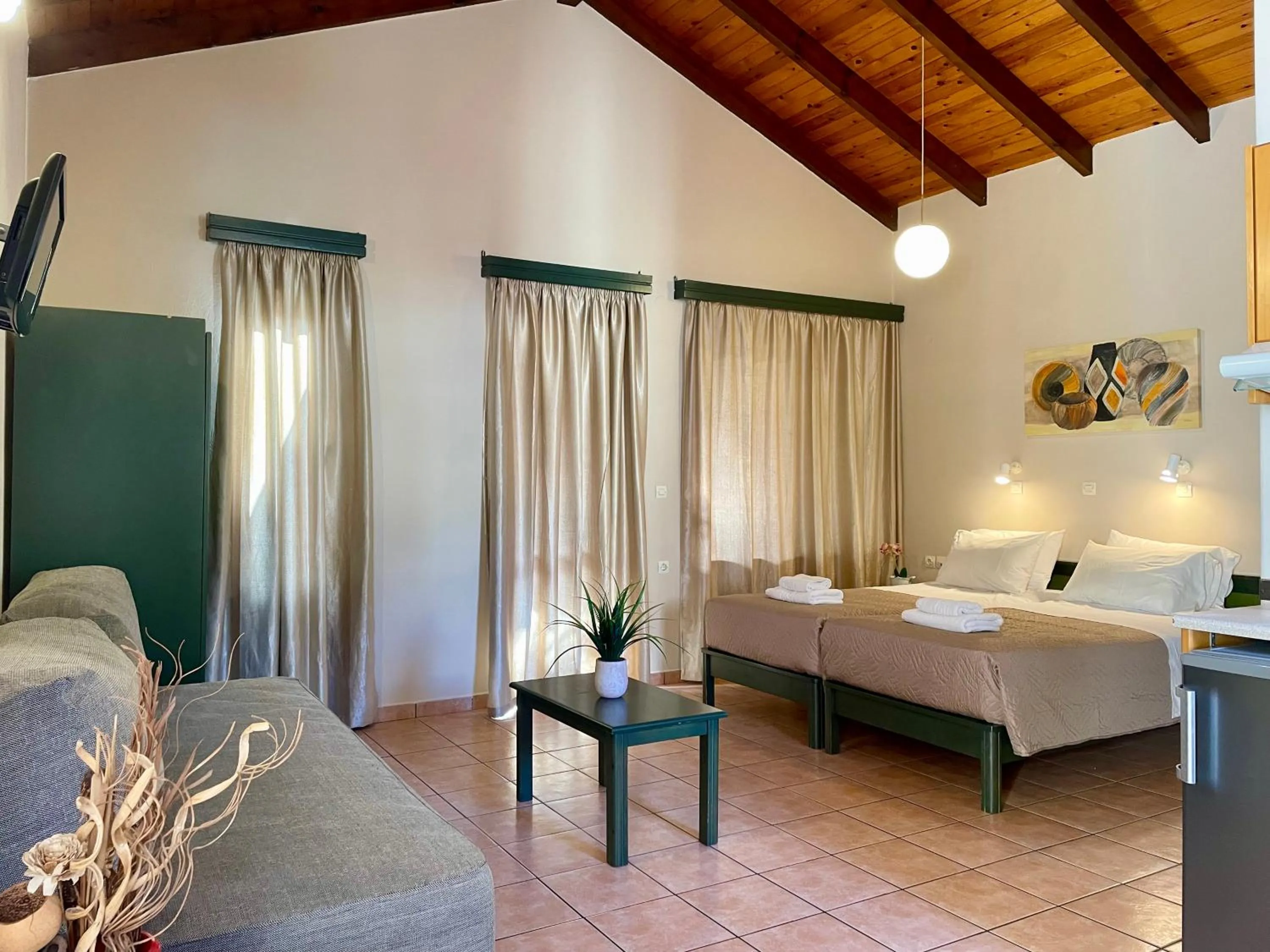 Bed in Theos Holidays Apartments