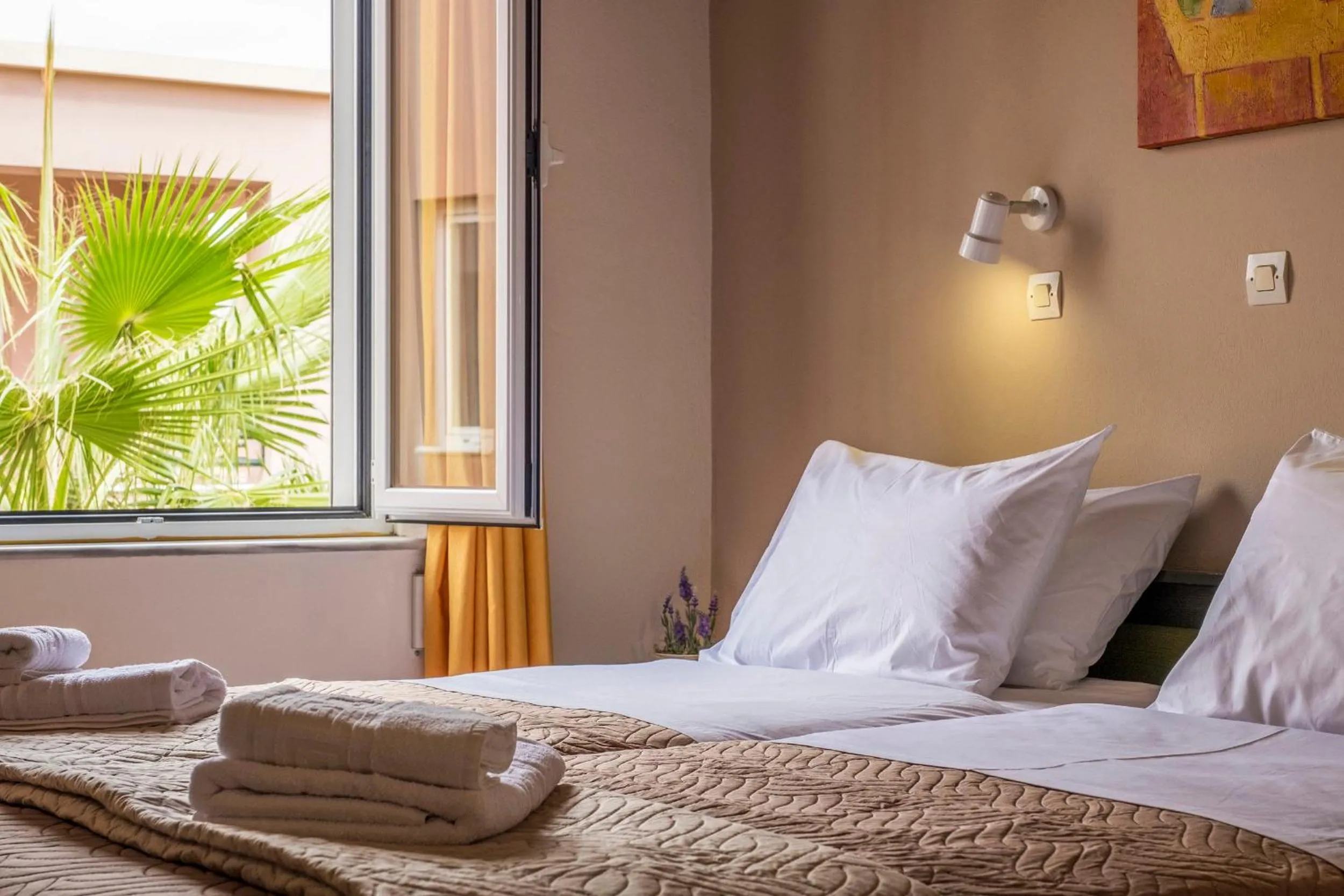 Bed in Theos Holidays Apartments