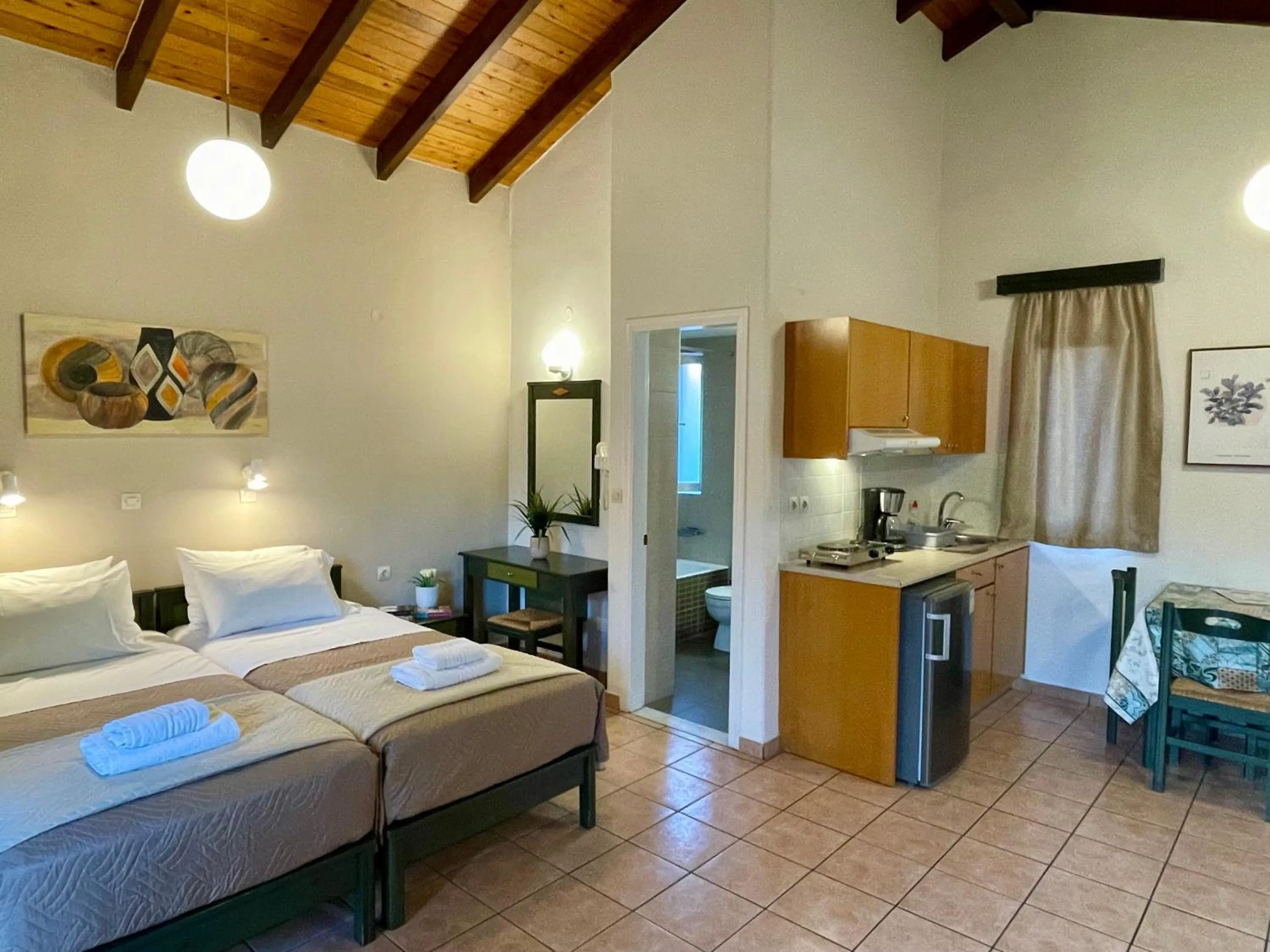 Bed in Theos Holidays Apartments