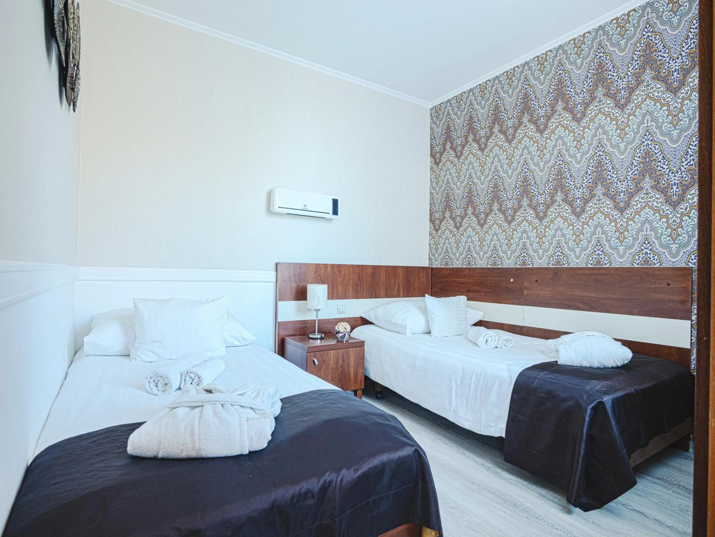 Bed in Holiday Beach Budapest Hotel