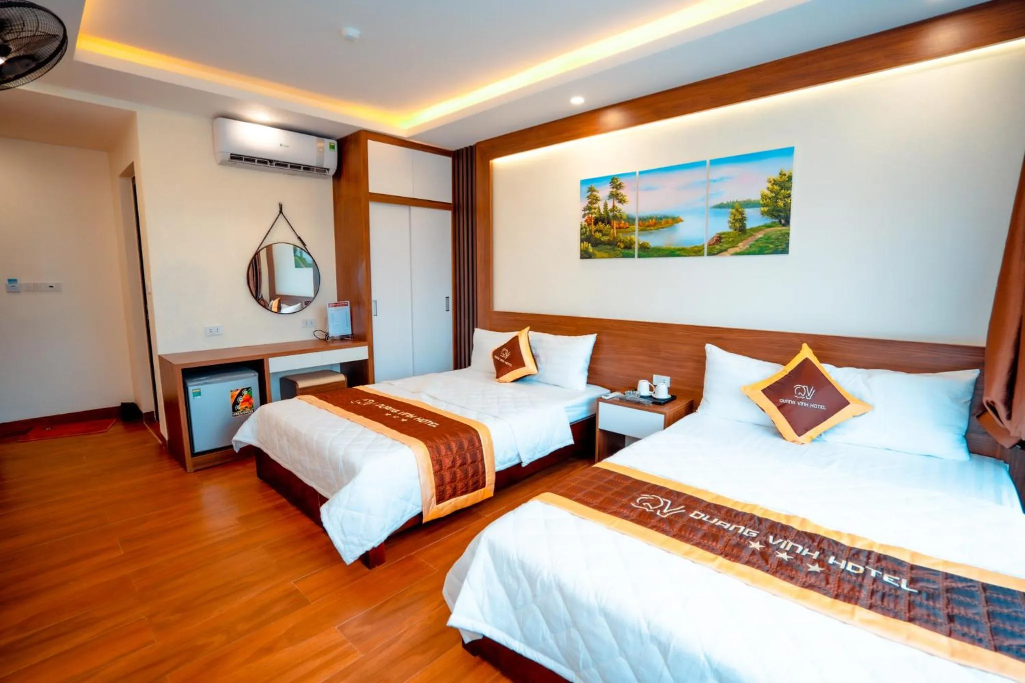 Bed in QUANG VINH HOTEL