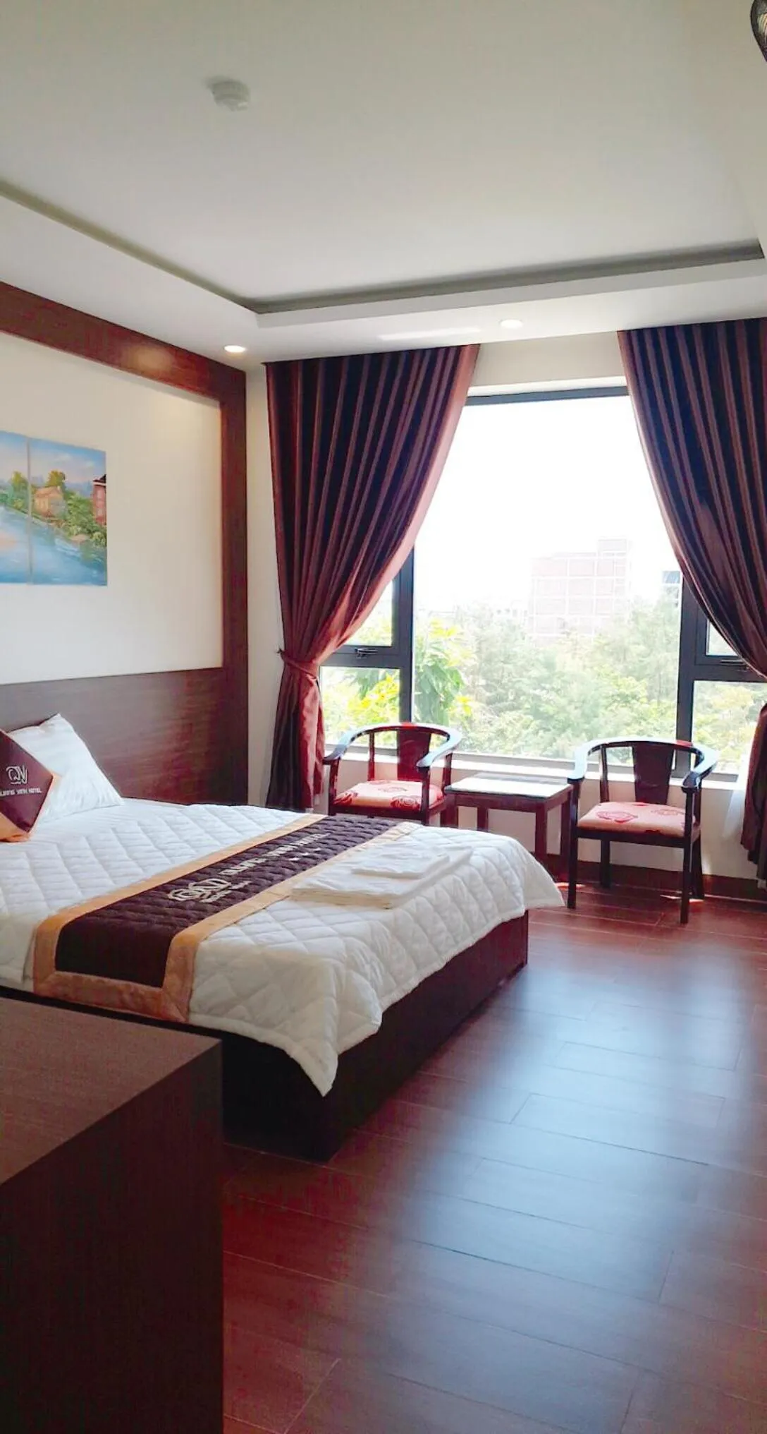 Bed in QUANG VINH HOTEL