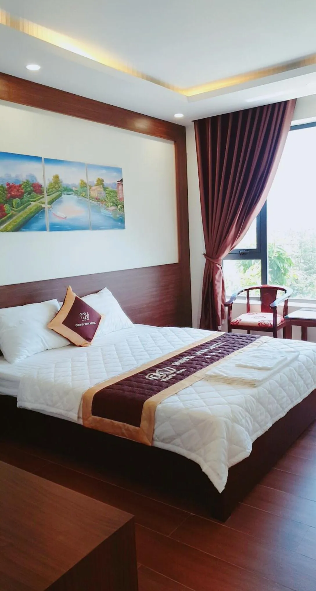 Bed in QUANG VINH HOTEL