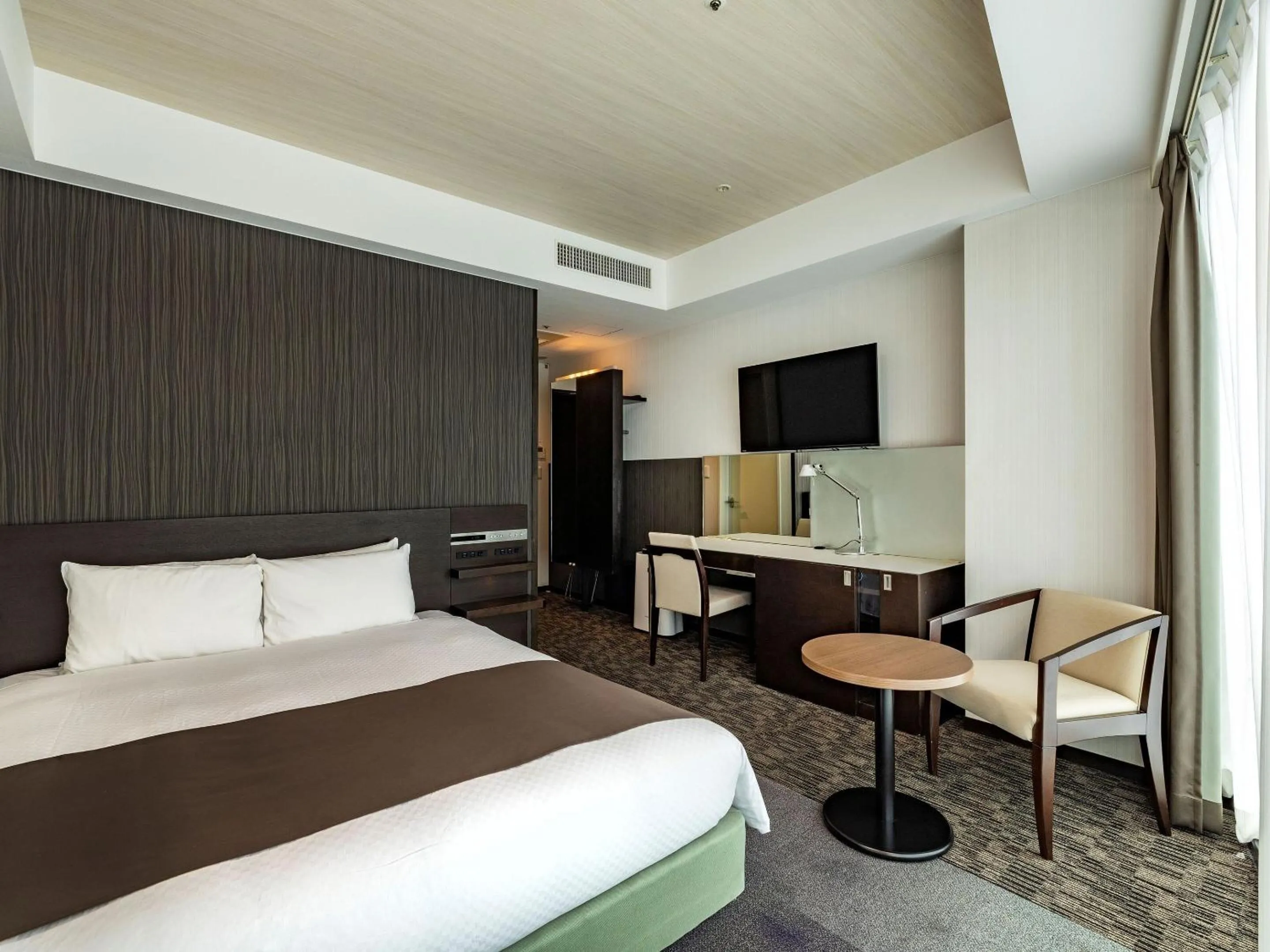 Photo of the whole room, Bed in KOKO HOTEL Premier Hakata - formerly Tenza Hotel at Hakata Station