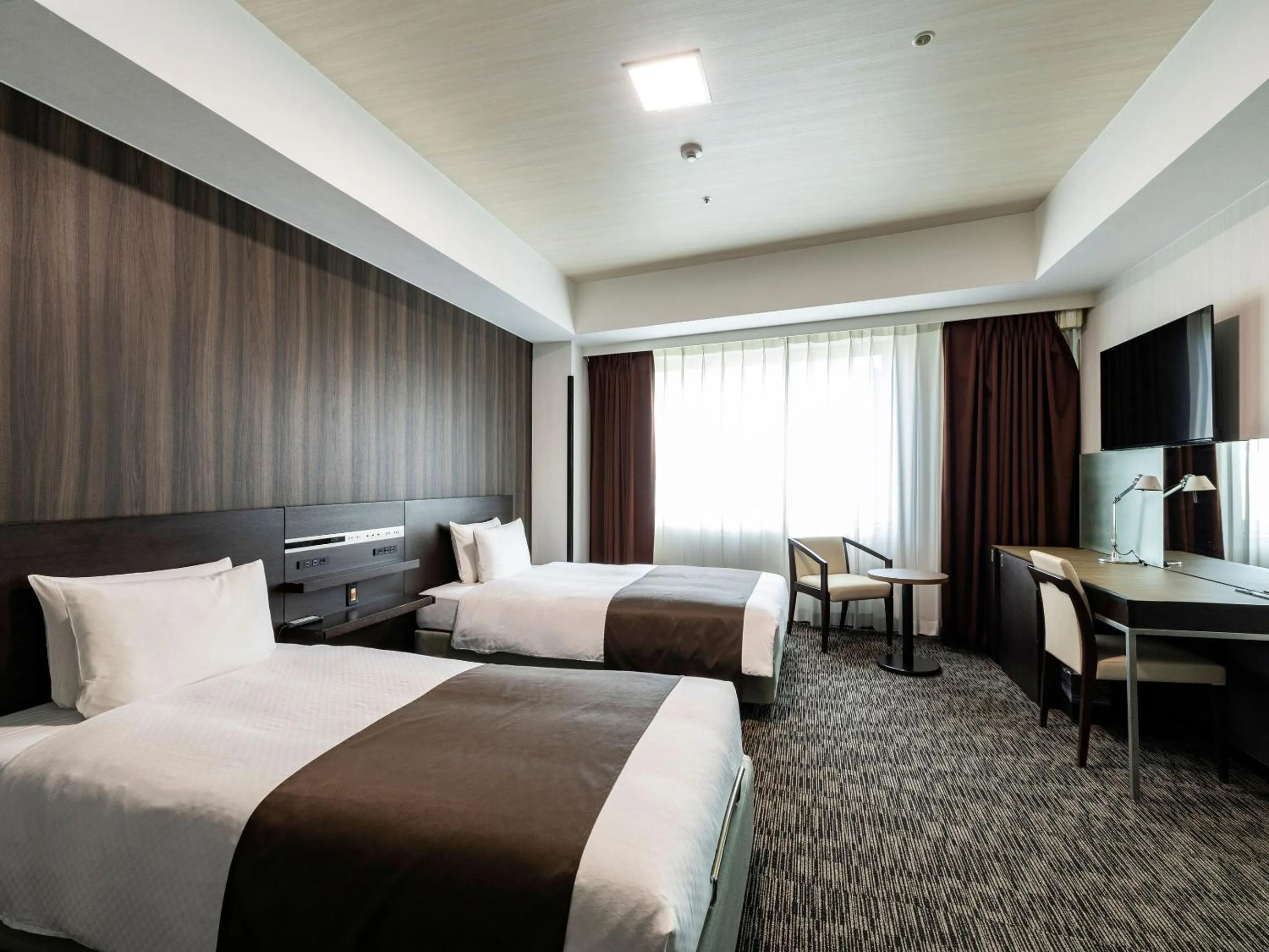 Photo of the whole room, Bed in KOKO HOTEL Premier Hakata - formerly Tenza Hotel at Hakata Station
