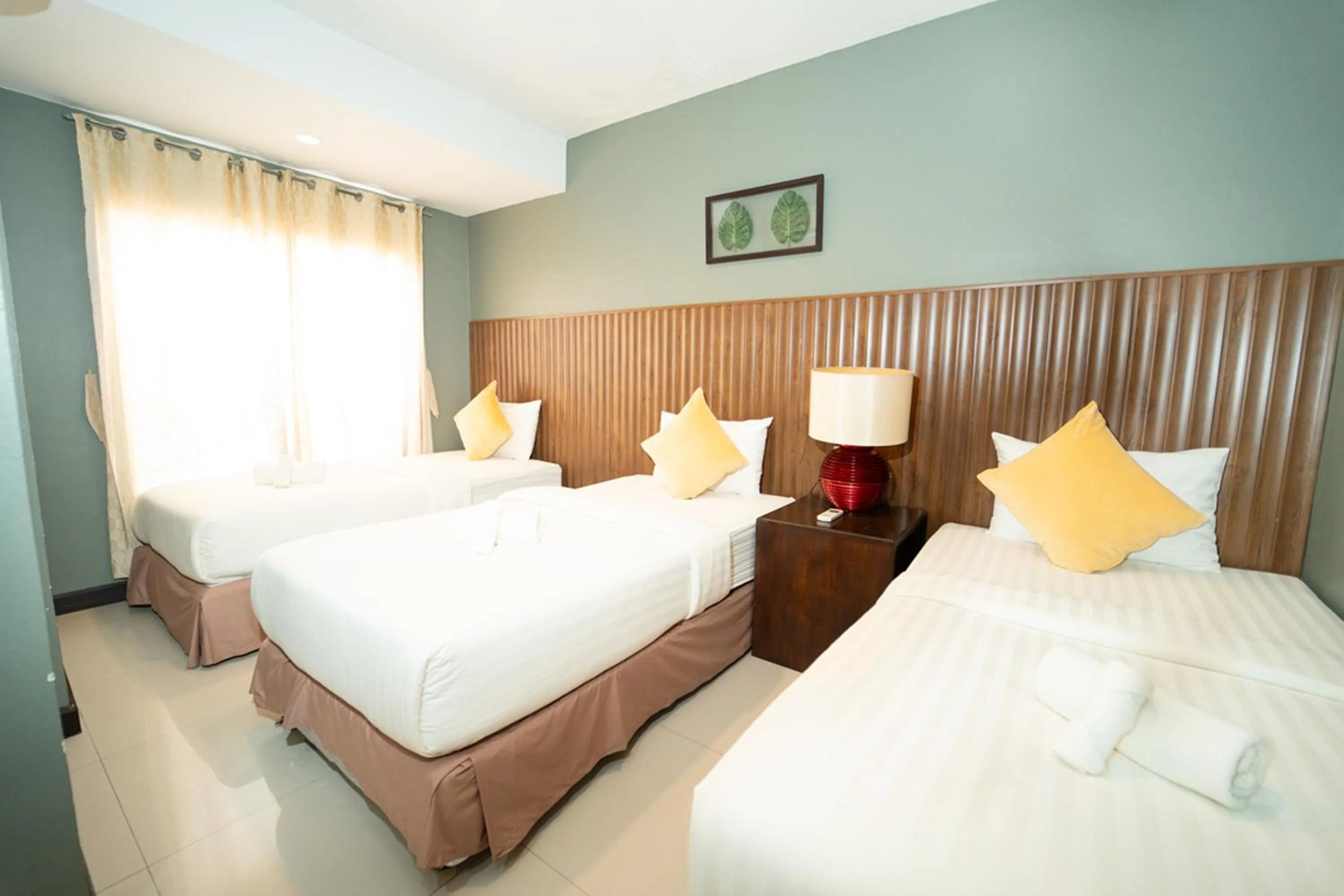 Bed in The Palm Hotel