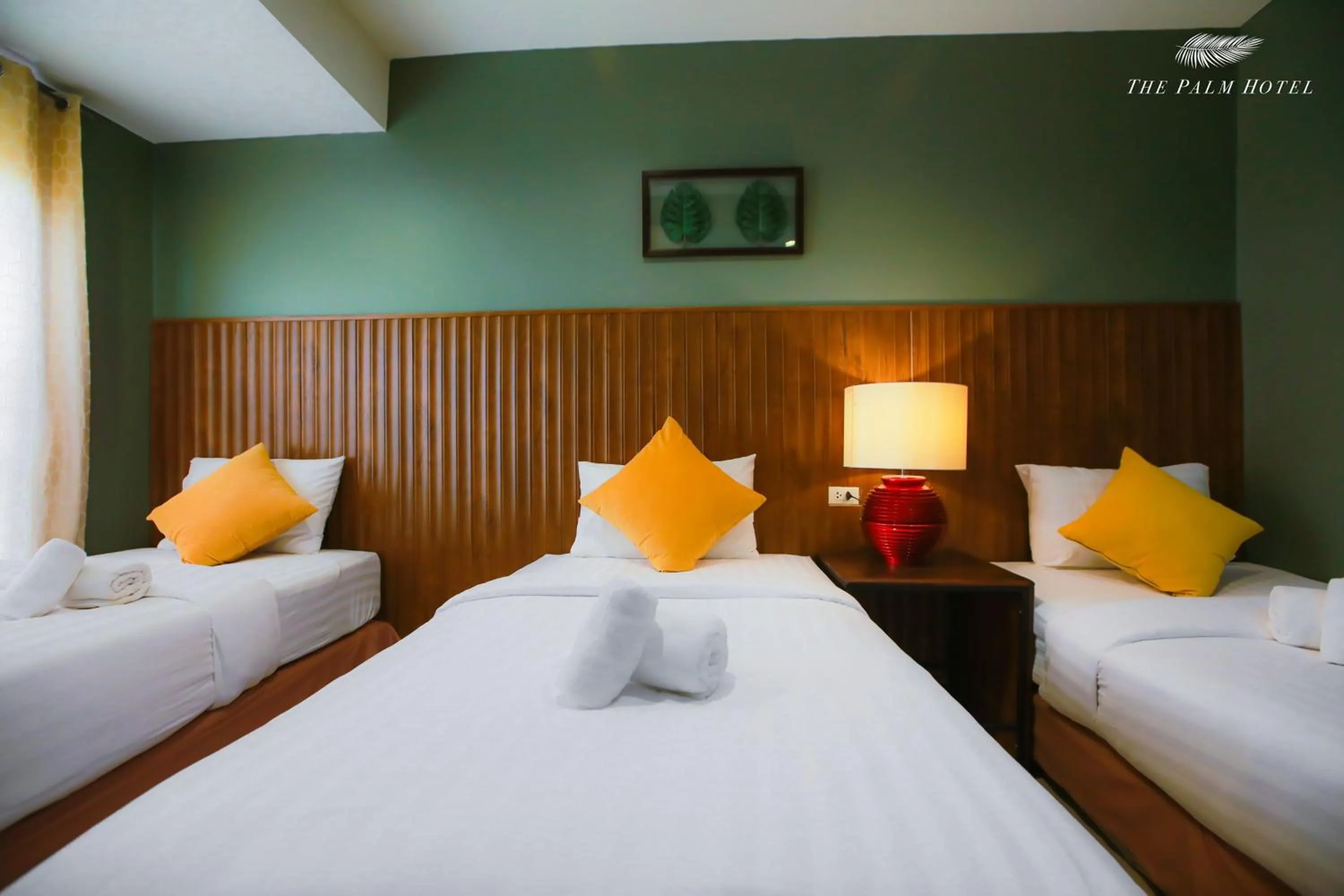 Bed in The Palm Hotel