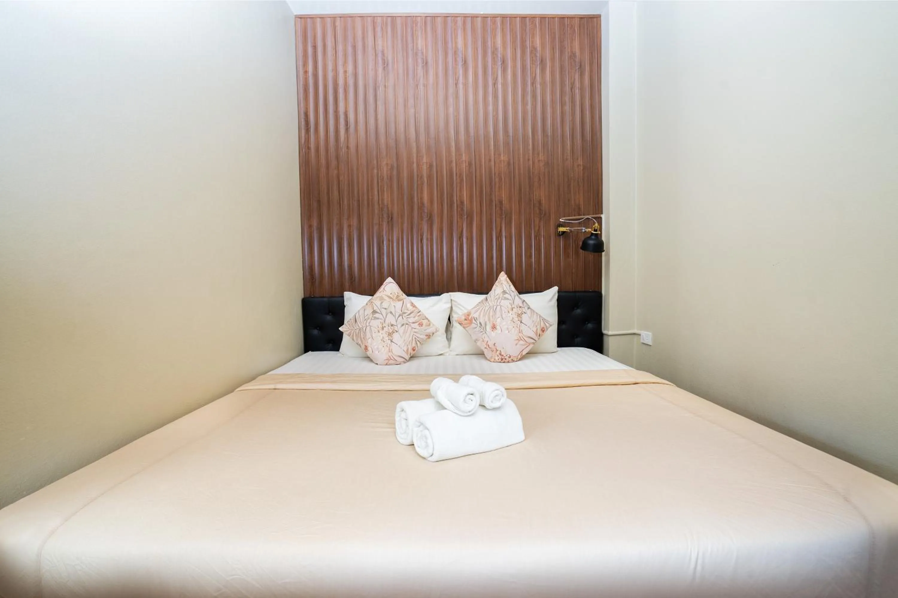 Bed in The Palm Hotel